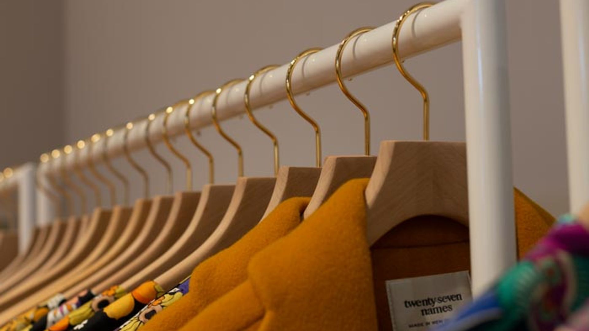 twenty-seven names - retail clothing racks banner
