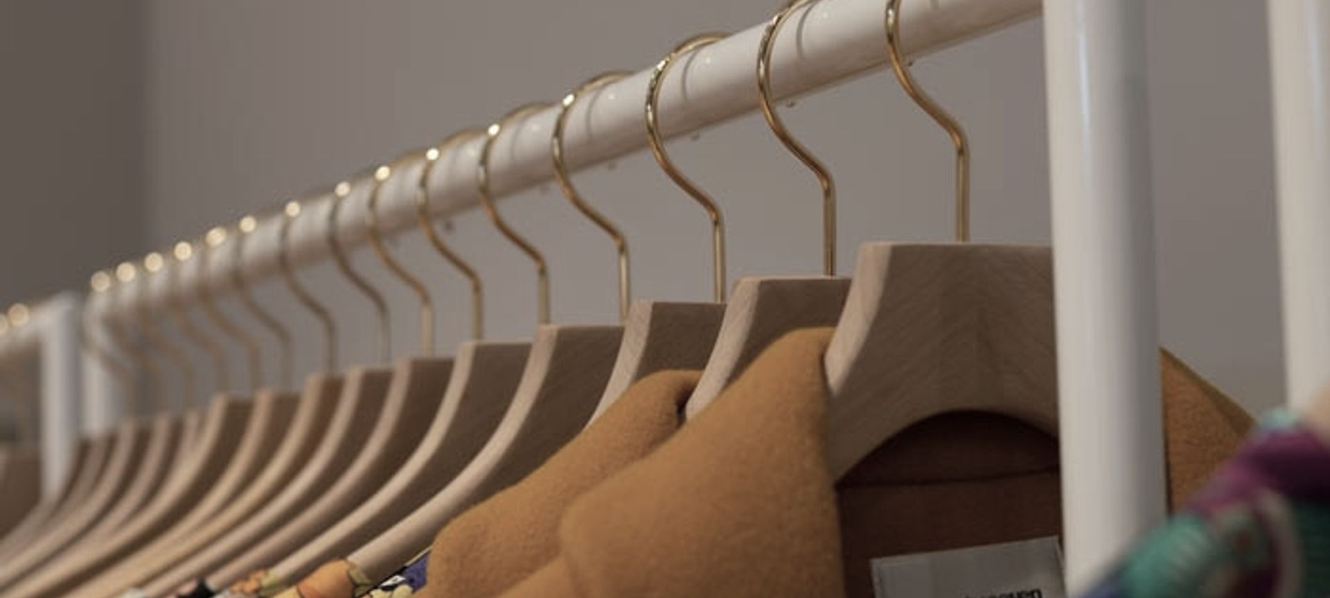 twenty-seven names - retail clothing racks banner