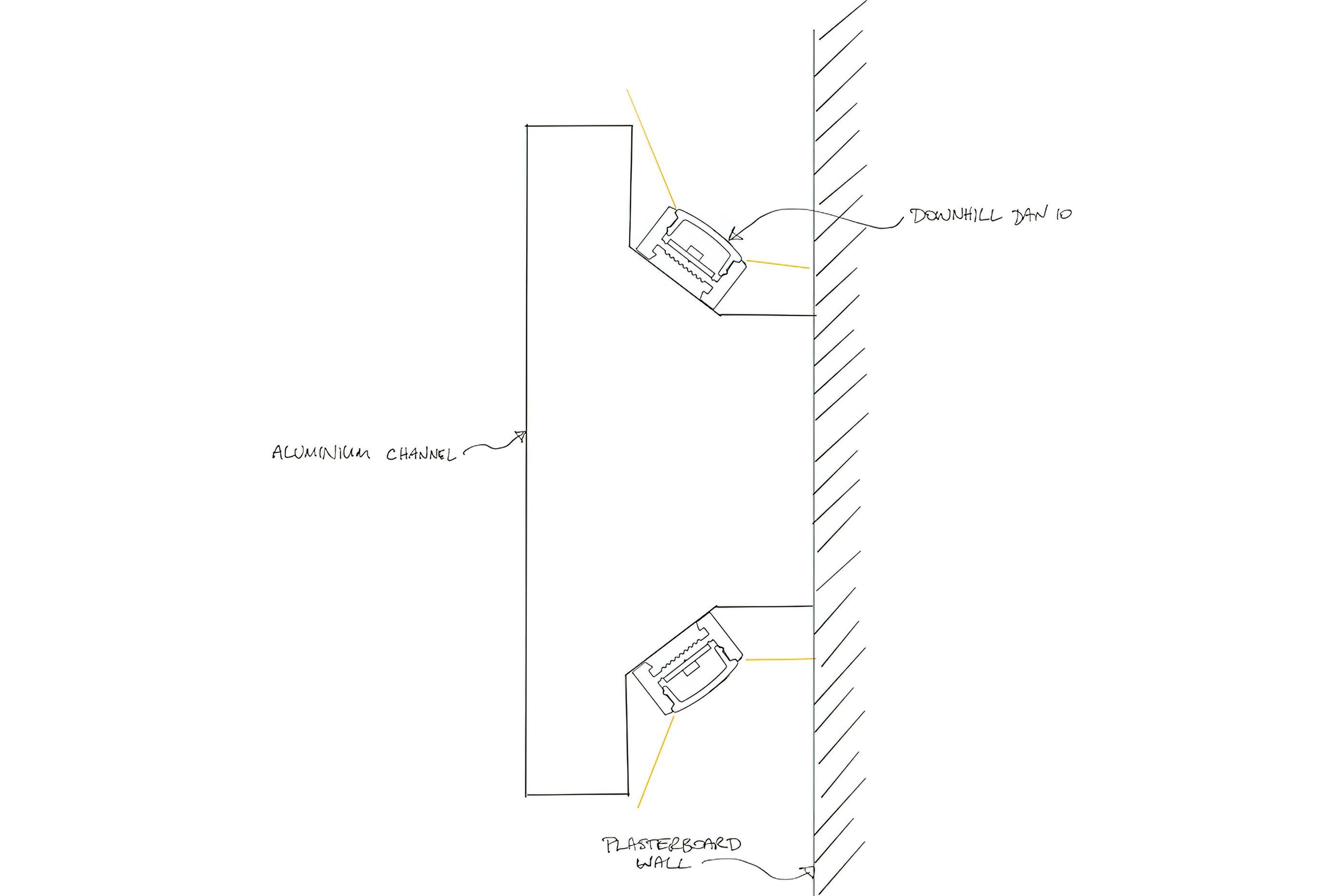 This sectional detail shows how two Downhill Dan 10s were used to illuminate the walls above and below the aluminium joinery rail that ran the perimeter of the store. The Downhill Dan 10 profiles were attached to the dado rail via a double-sided VHB tape.