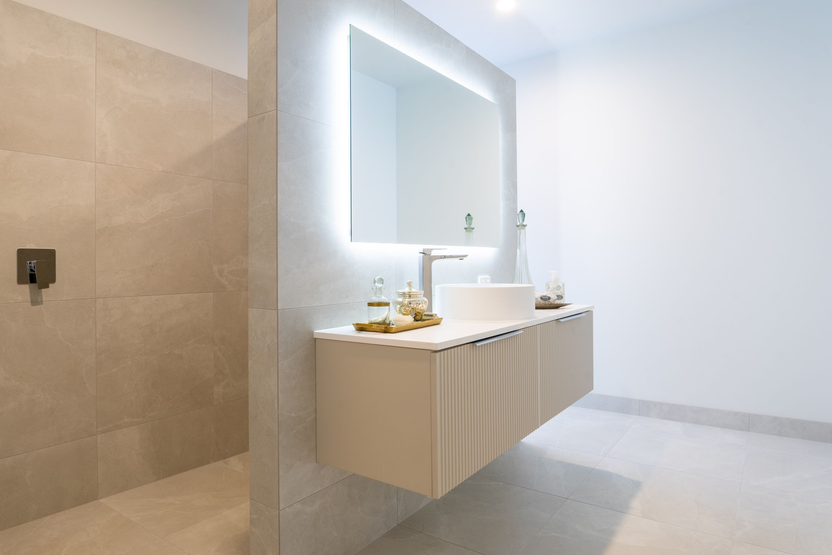 Neutral tones continue through to the designer bathrooms.