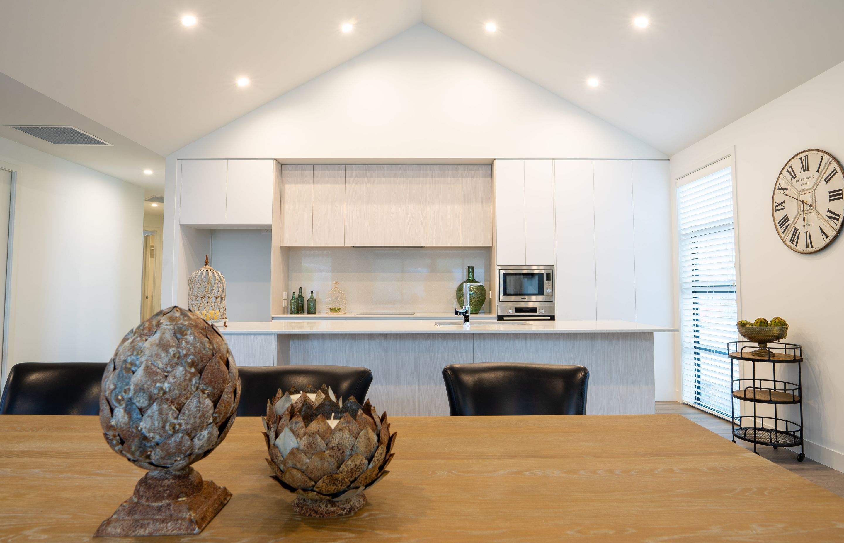 A gabled ceiling makes the open-plan kitchen and living feel spacious.