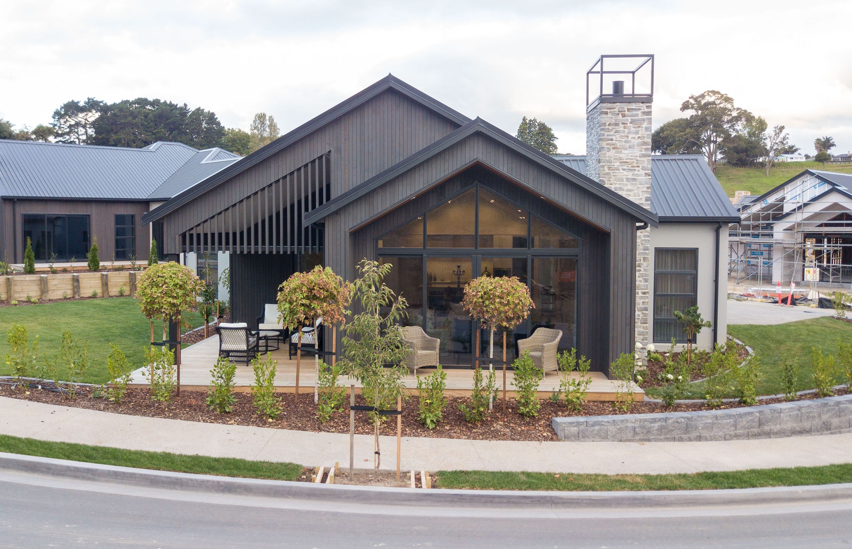 Stained cedar and schist stone provide a modern aesthetic.