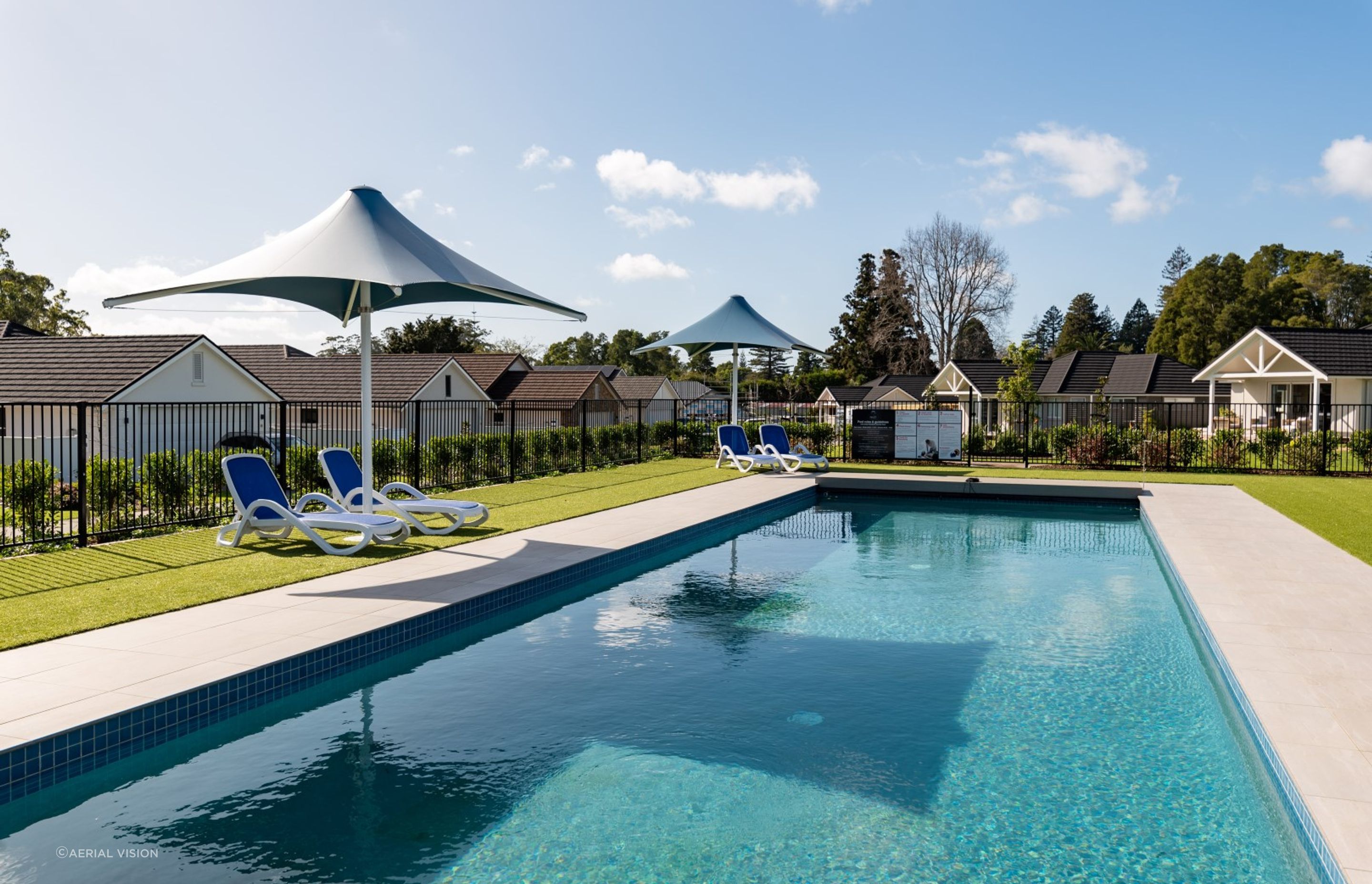 pool-umbrellas-arcline-architecture-blue-retirement-village.jpg