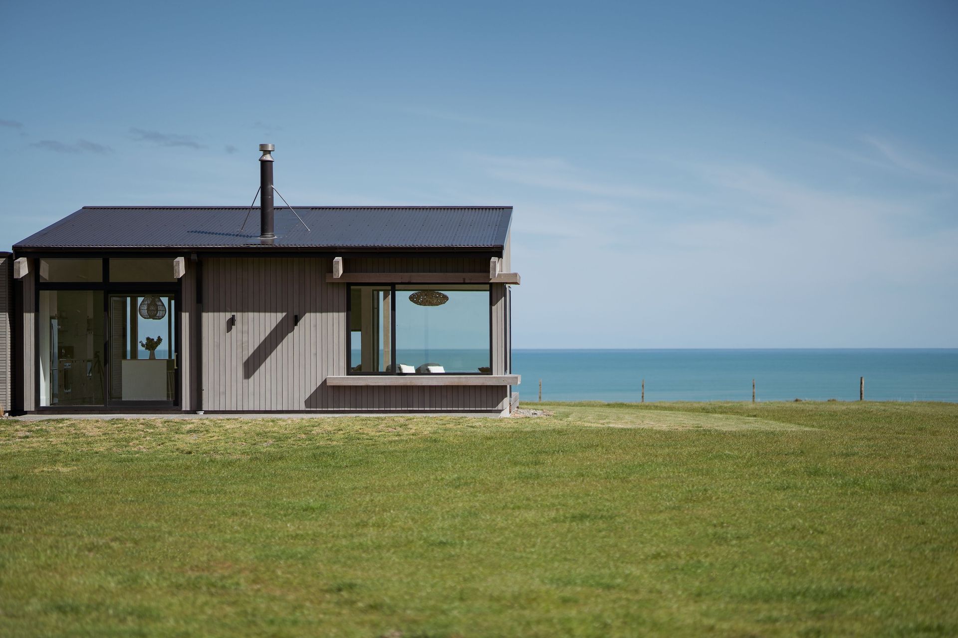 Passive environmentally sustainable design principles, such as maximising solar gain, were one of the key design drivers. Large windows around the northern corner of the home capture all-day sun.