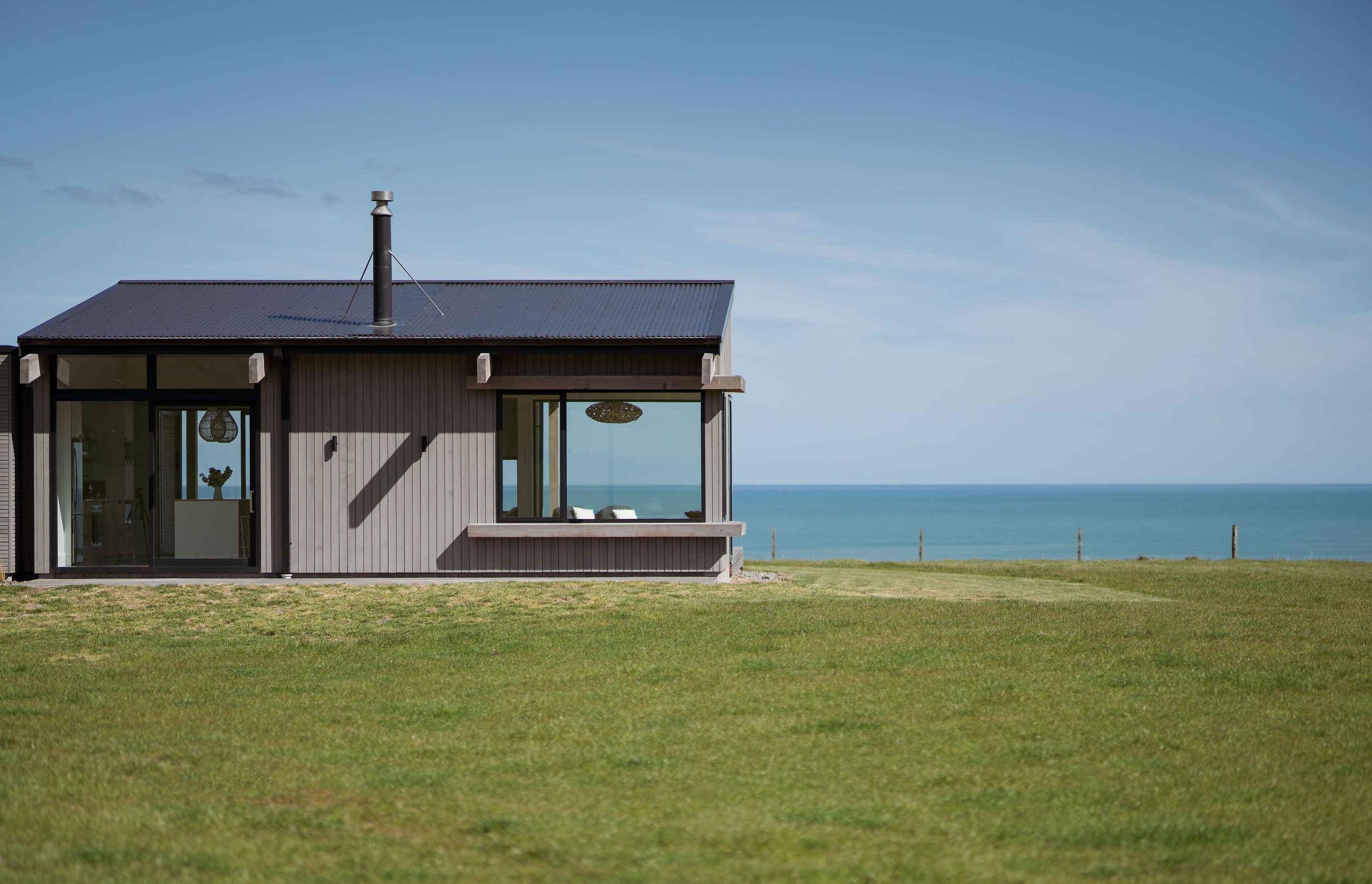 Passive environmentally sustainable design principles, such as maximising solar gain, were one of the key design drivers. Large windows around the northern corner of the home capture all-day sun.