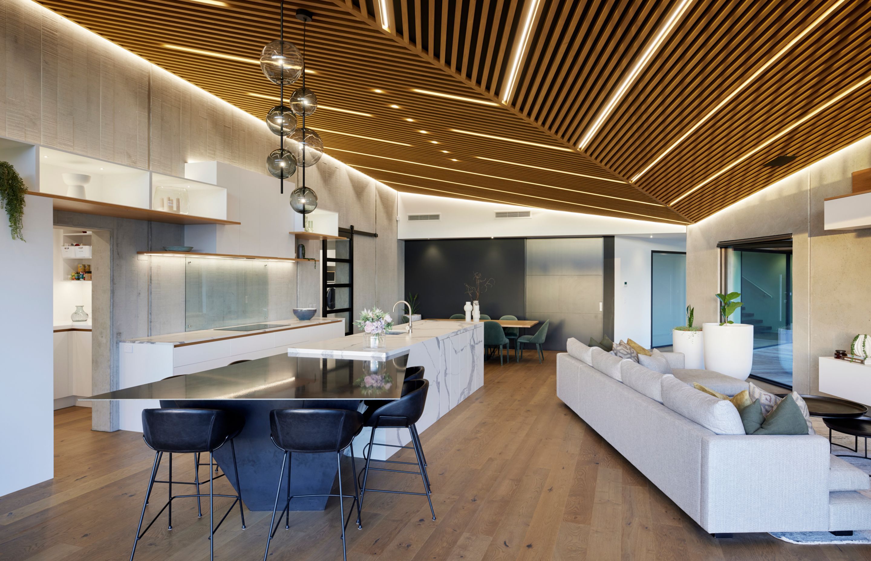 “The whole area comes alive at night as light accentuates the textures and the cedar-slatted ceiling is stunning with the in-laid linear lights – it’s fantastic at night,” says Lee.