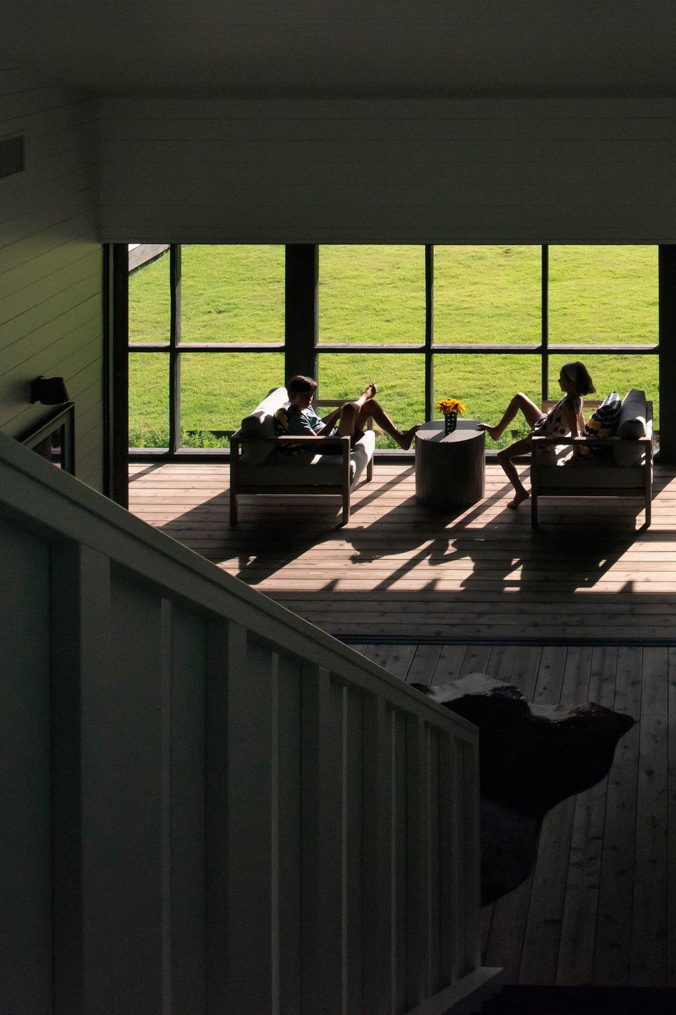 10CampFrioCuppettKilpatrickArchitectureandInteriorDesignscreened-porch-relaxation-lounge-chairs-interior-view.jpg