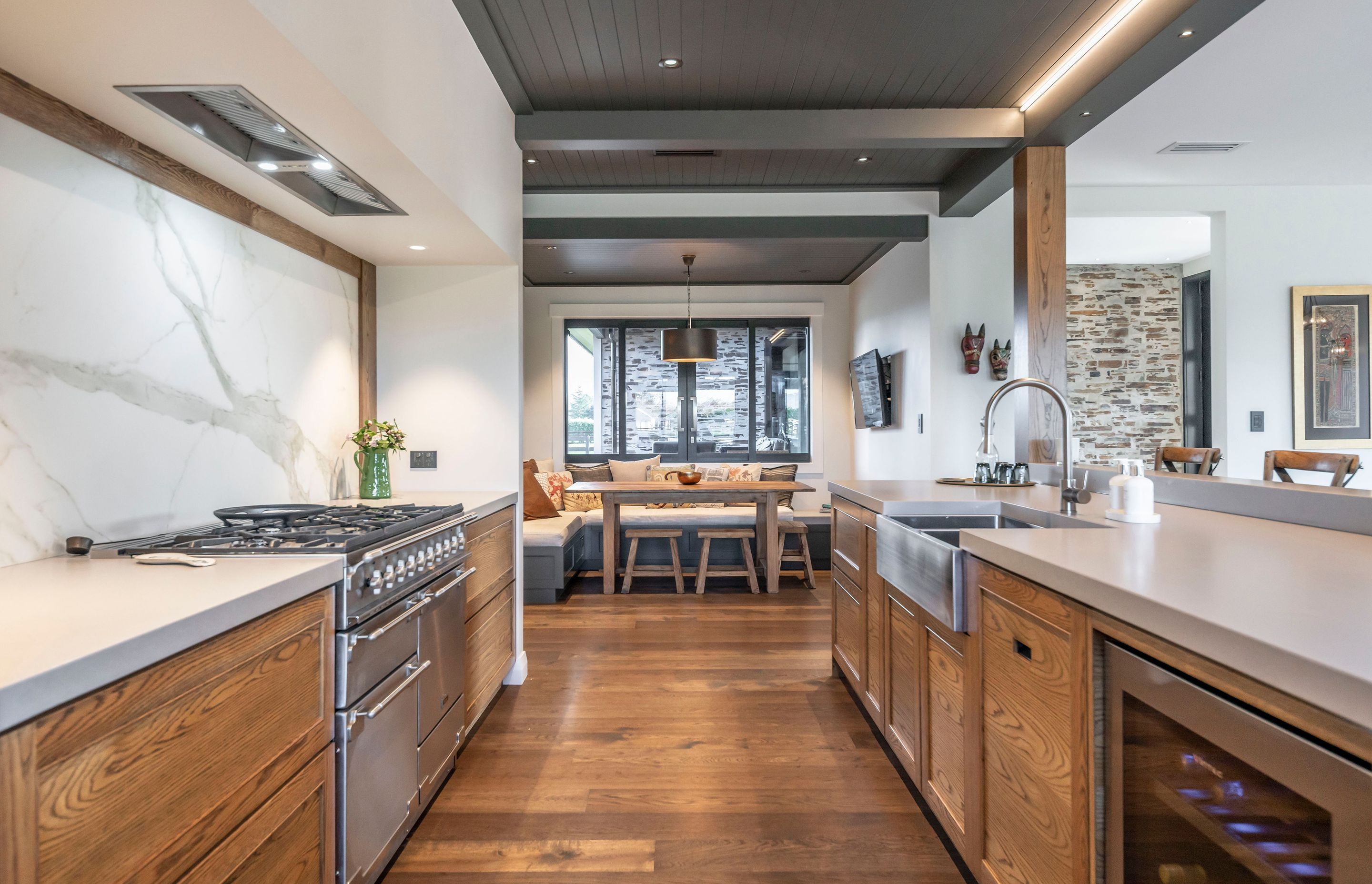 Adjacent to the kitchen is a dining nook, one of the must-have elements the homeowners wanted incorporated into the design.