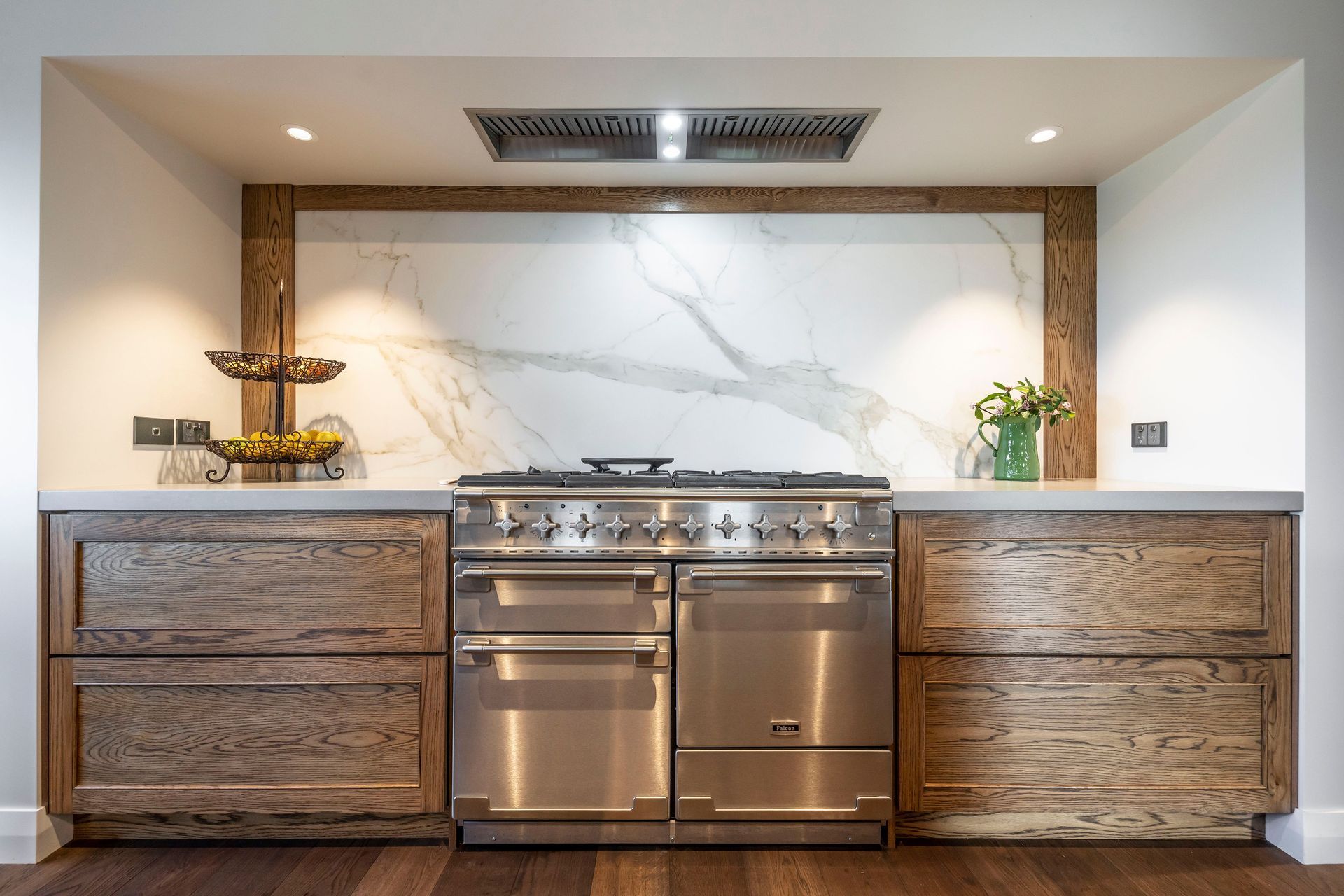 Natural materials sit side-by-side with industrial elements creating a sophisticated cooking zone in the kitchen.