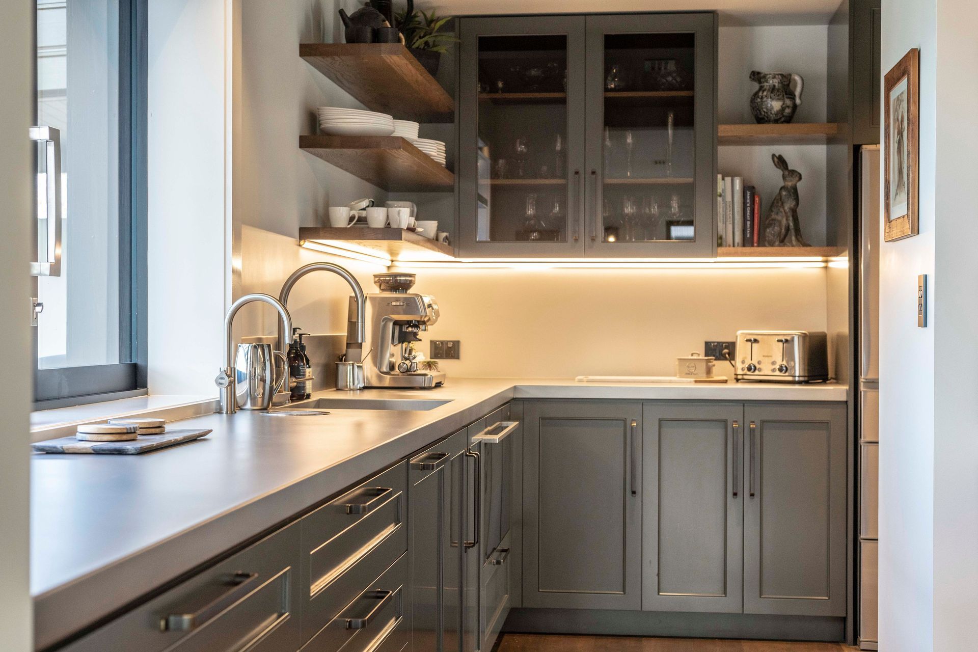 Off to one side, the preparation area allows mess to be kept to a minimum in the "public" area of the kitchen.