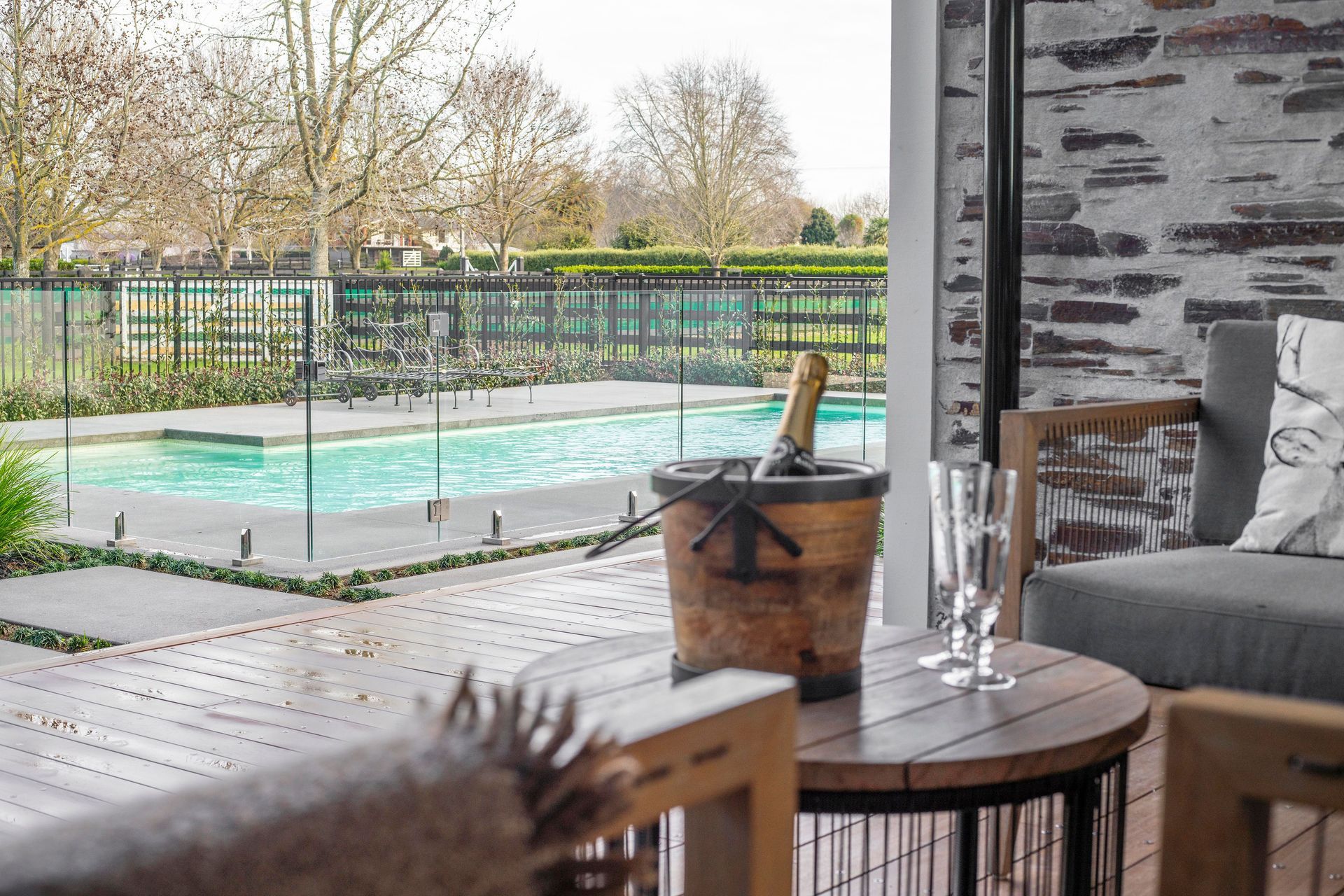 A covered outdoor entertaining area leads onto the swimming pool and further grounds.