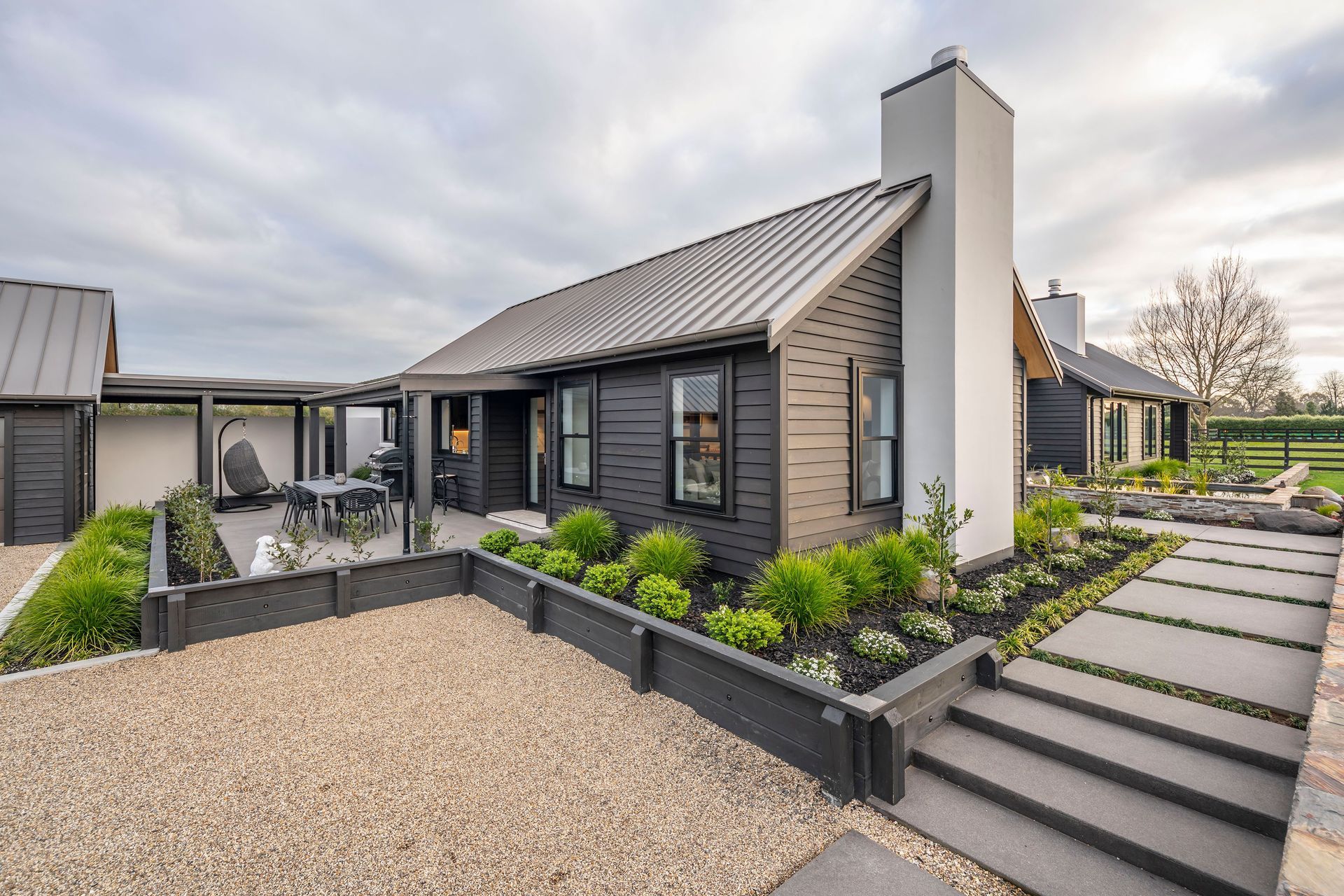 Visitors walk past the breakfast patio on their way to the front door.
