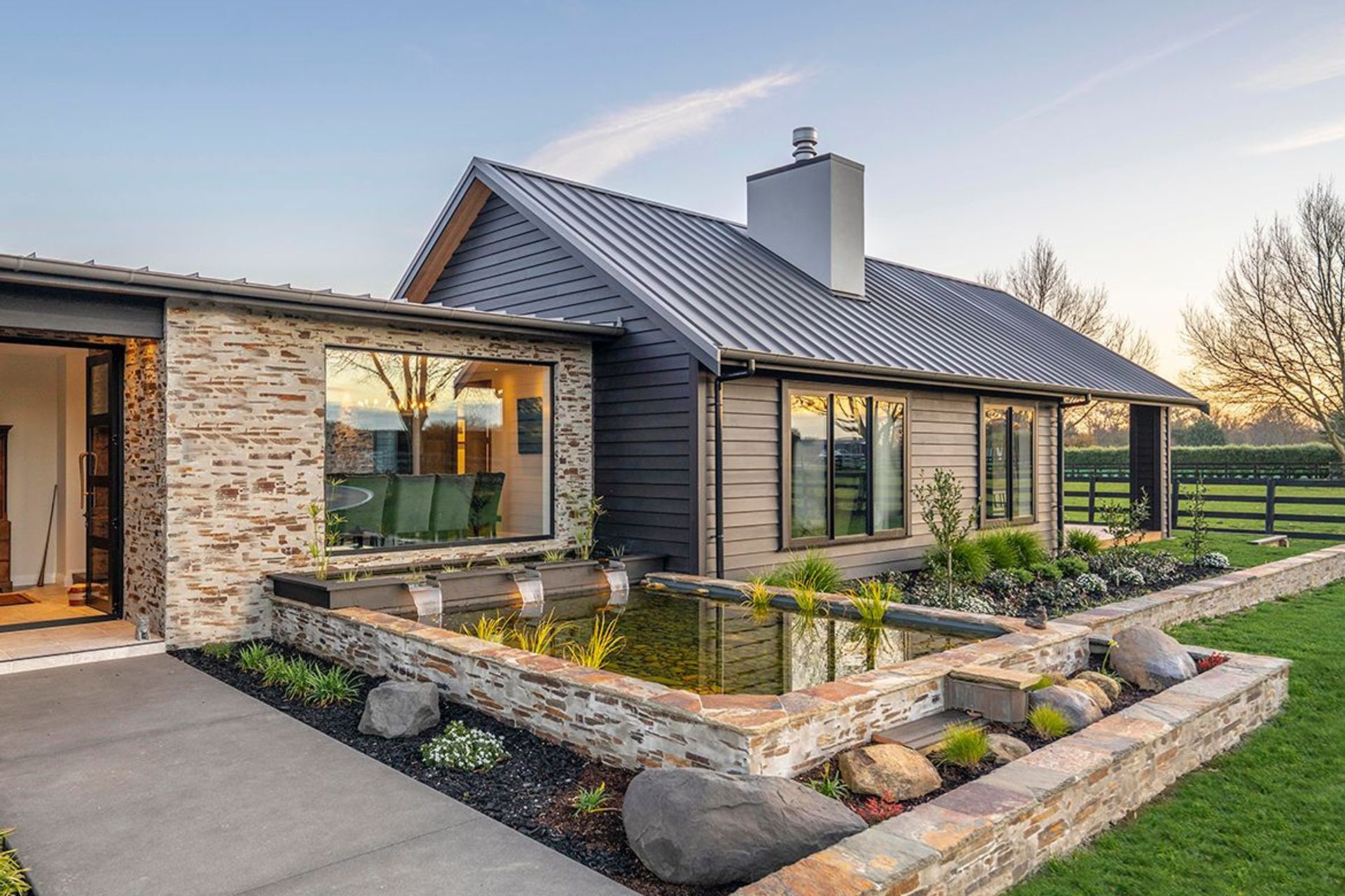 A large picture window affords a view from the formal dining are onto the pond.