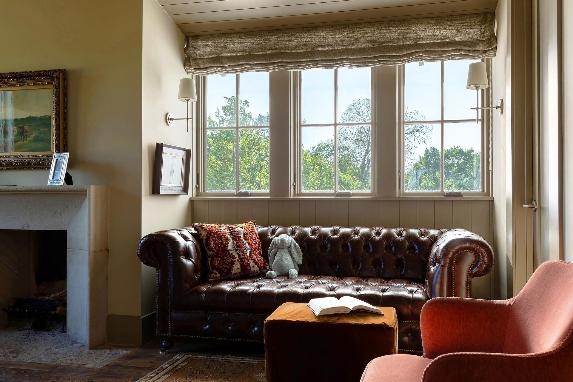11HomeontheRangeCuppettKilpatrickArchitectureandInteriorDesignleather-sofa-stone-fireplace-window-view.jpg