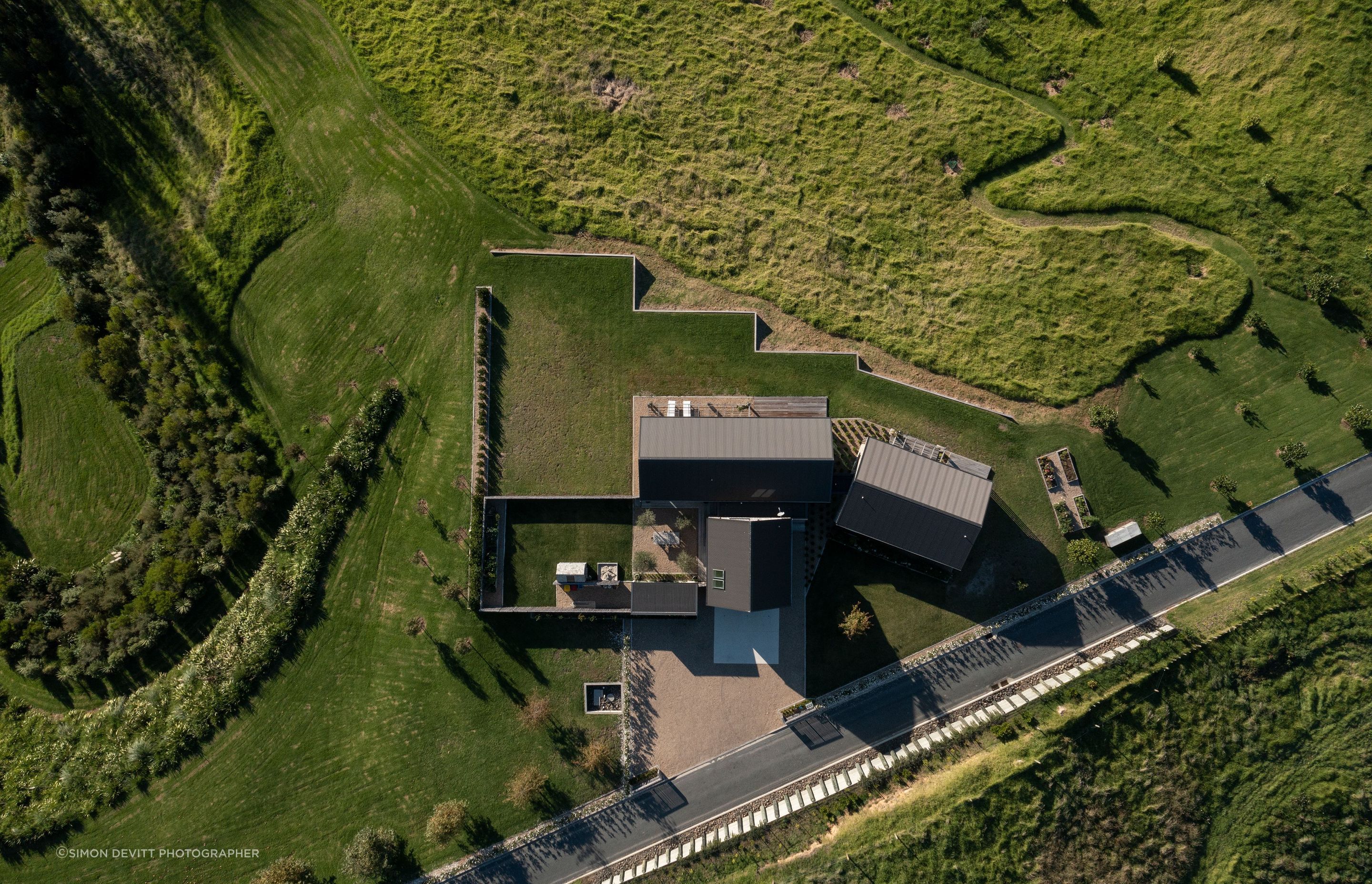 A bird's eye view of the three buildings; the bedroom wing on the right is offset from the living wing to ensure privacy.