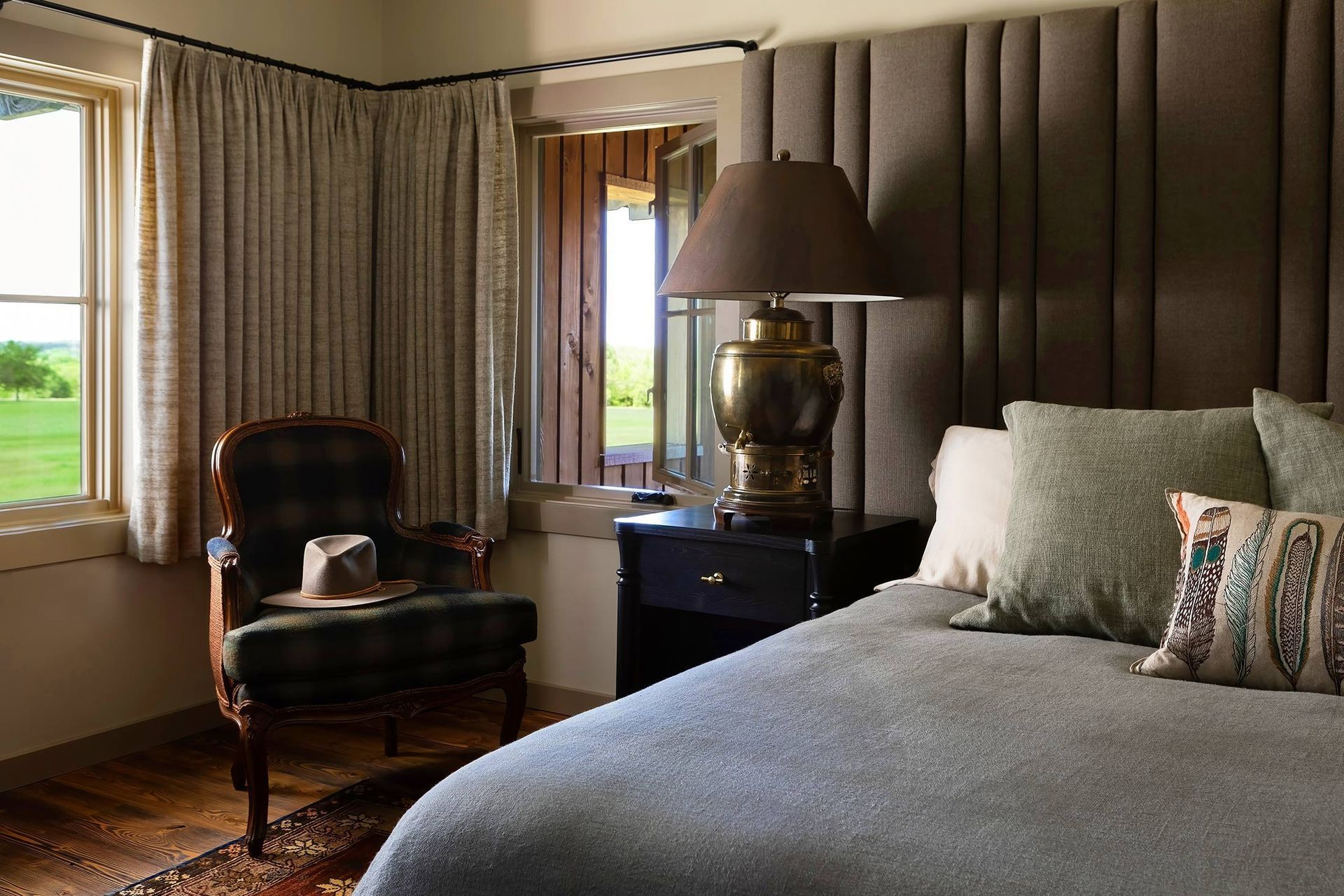15HomeontheRangeCuppettKilpatrickArchitectureandInteriorDesigntraditional-headboard-leather-armchair-bedroom.jpg