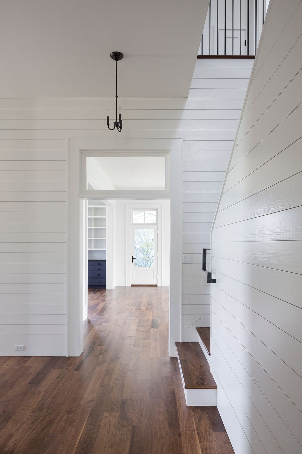 16PendletonFarmCuppettKilpatrickArchitectureandInteriorDesignaustin-tx-modern-stairway-shiplap-wall-metal-railing-1.jpg