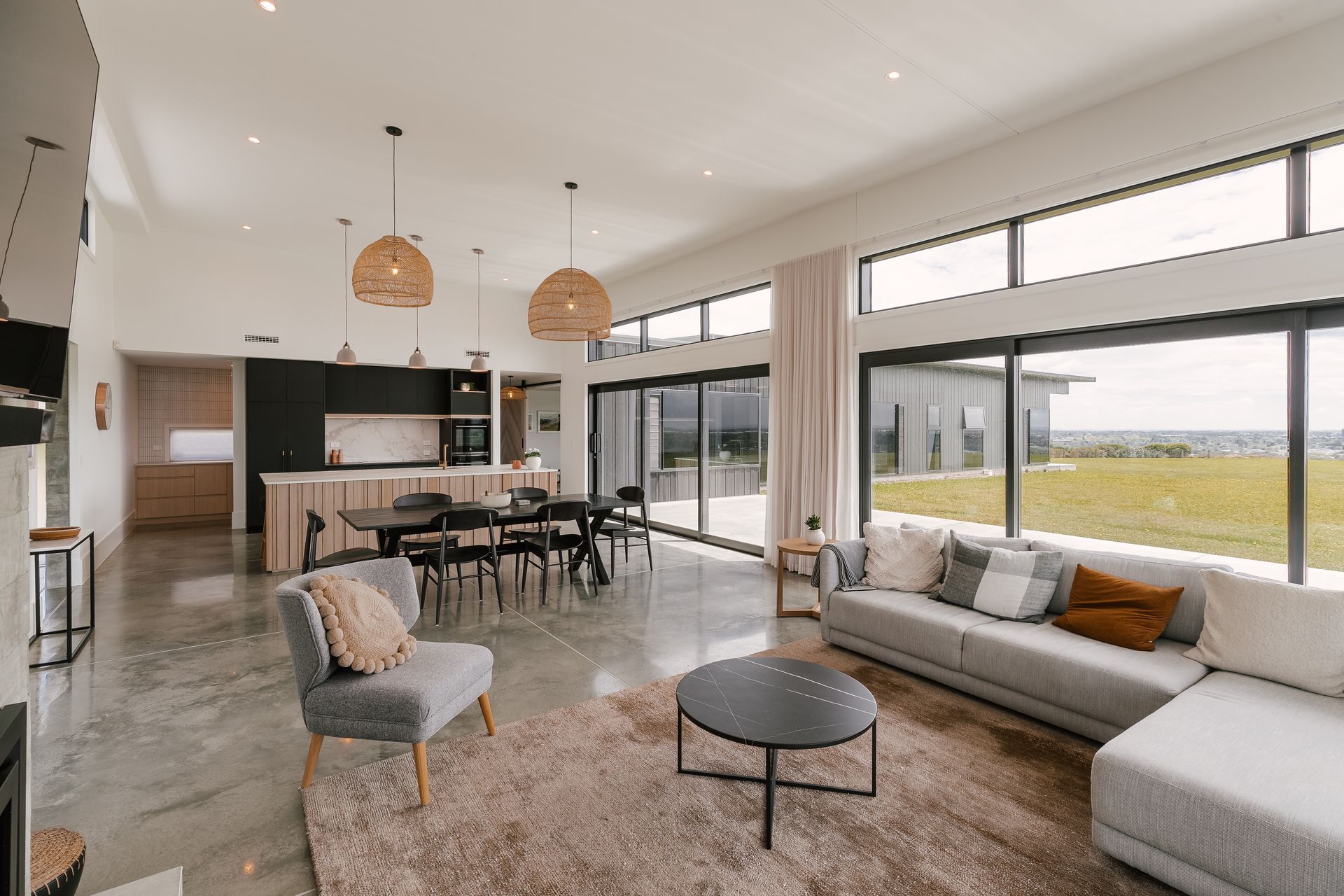 A beautiful Palmerston North Oasis streaming with natural lighting over a soft and bold contemporary kitchen
