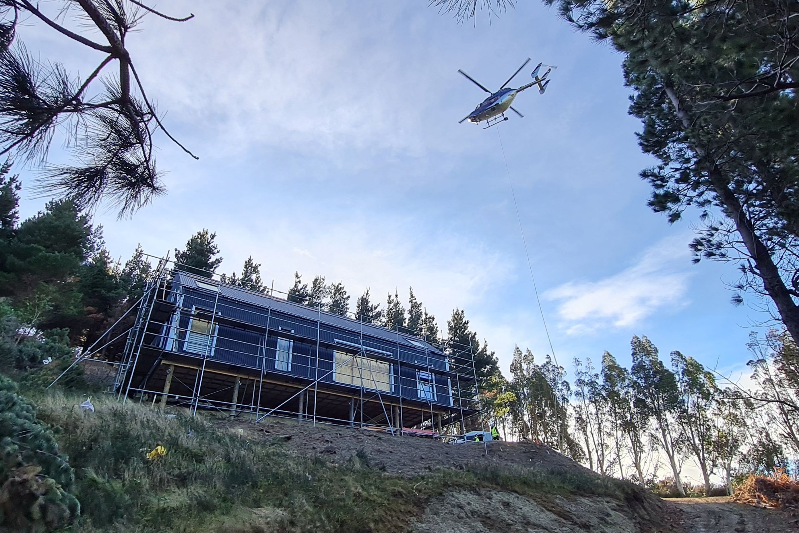 Helicopter delivery of materials during construction