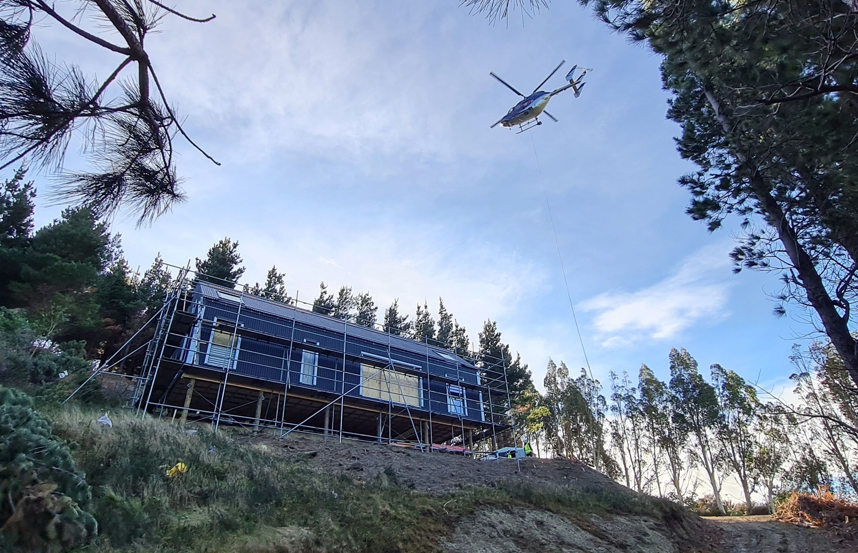 Helicopter delivery of materials during construction