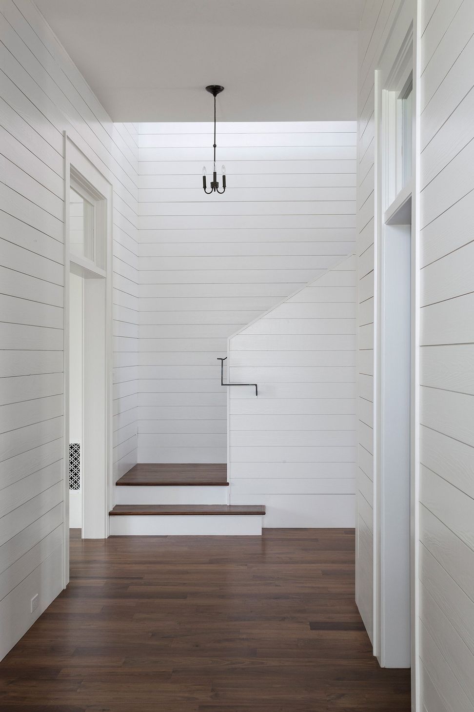 20PendletonFarmCuppettKilpatrickArchitectureandInteriorDesignaustin-tx-contemporary-stairwell-shiplap-walls-dark-wood-stairs.jpg