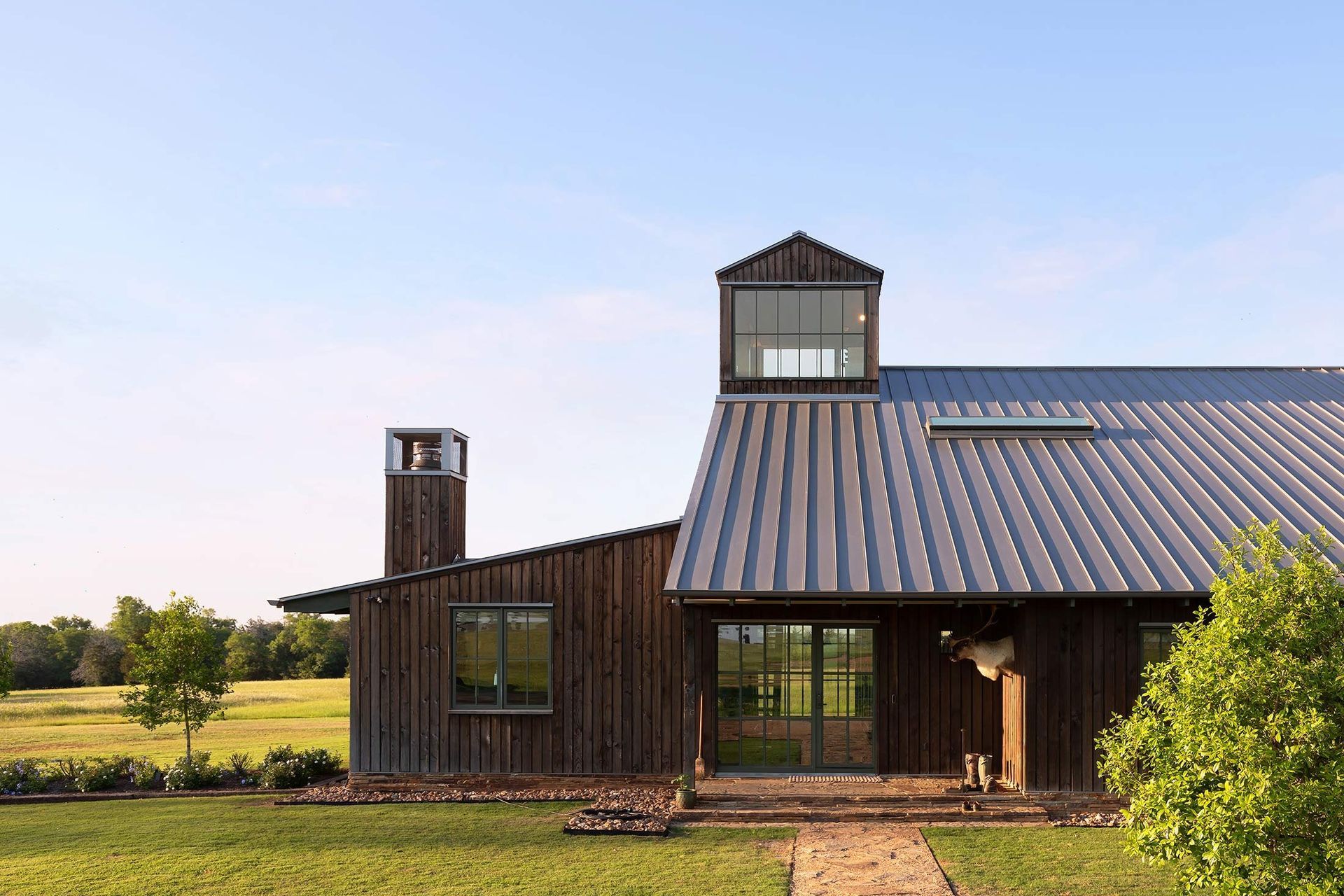 2HomeontheRangeCuppettKilpatrickArchitectureandInteriorDesignwood-siding-metal-roof-cupola.jpg