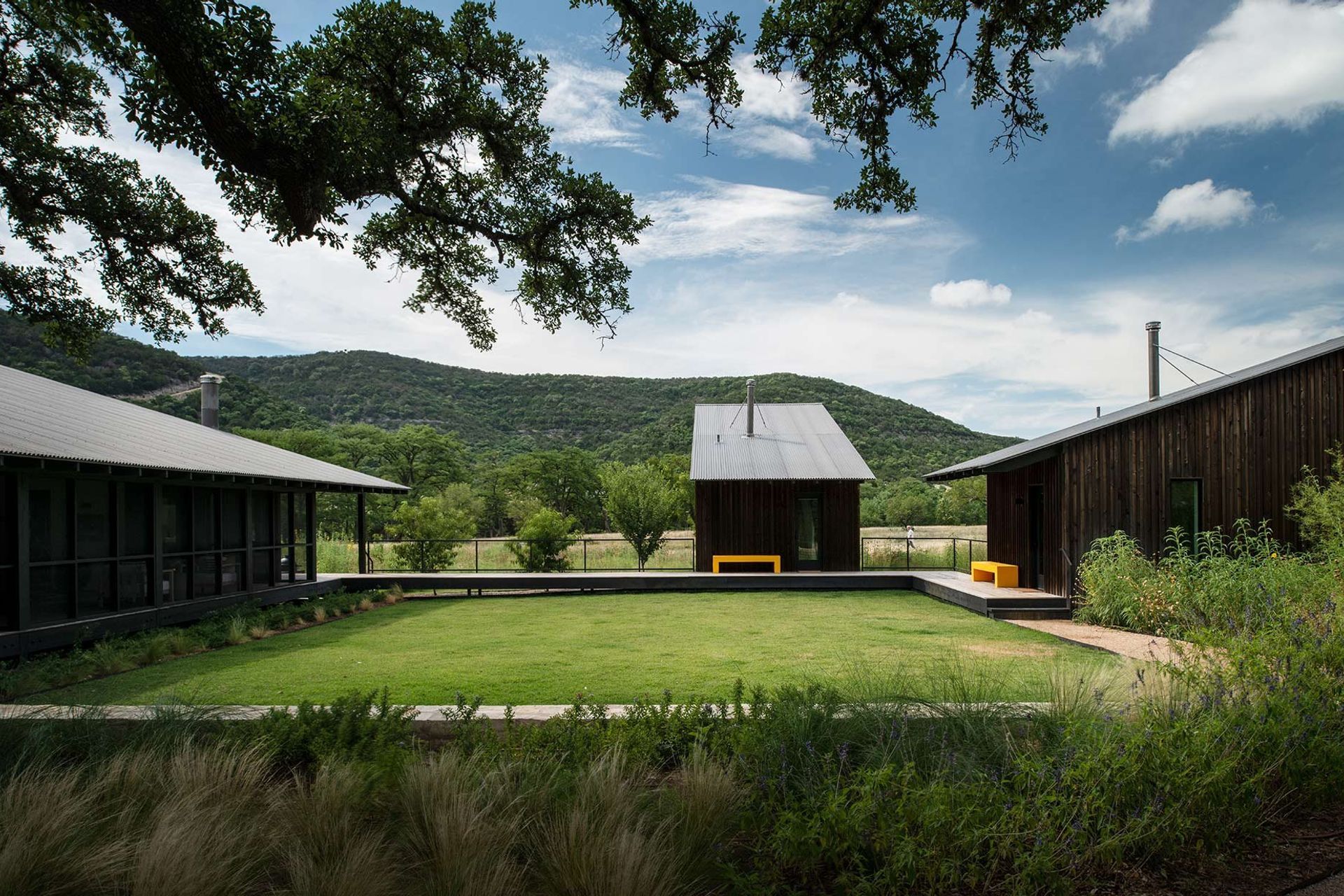 4CampFrioCuppettKilpatrickArchitectureandInteriorDesigncabins-central-courtyard-texas-hill-country.jpg