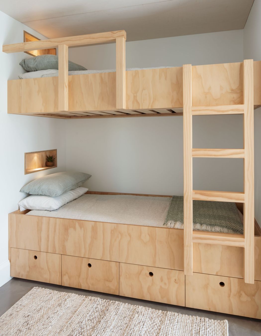 Originally designed as a two-bedroom bach, an additional bunk room was added to the design scheme so that the owners' grandchildren could spend time there as well.