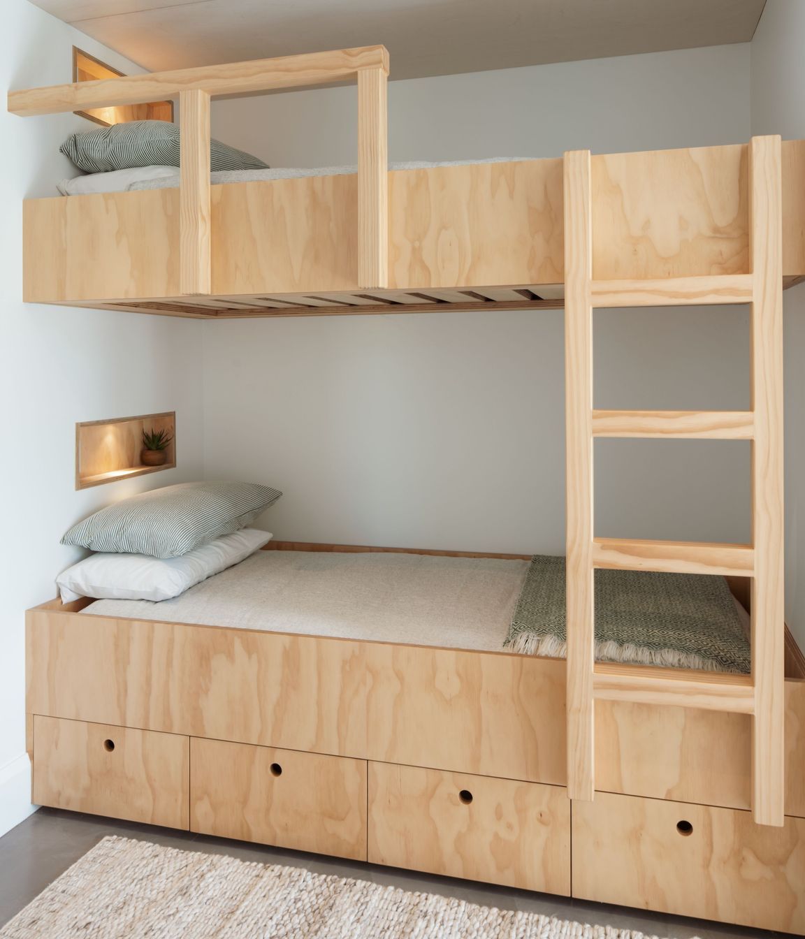 Originally designed as a two-bedroom bach, an additional bunk room was added to the design scheme so that the owners' grandchildren could spend time there as well.