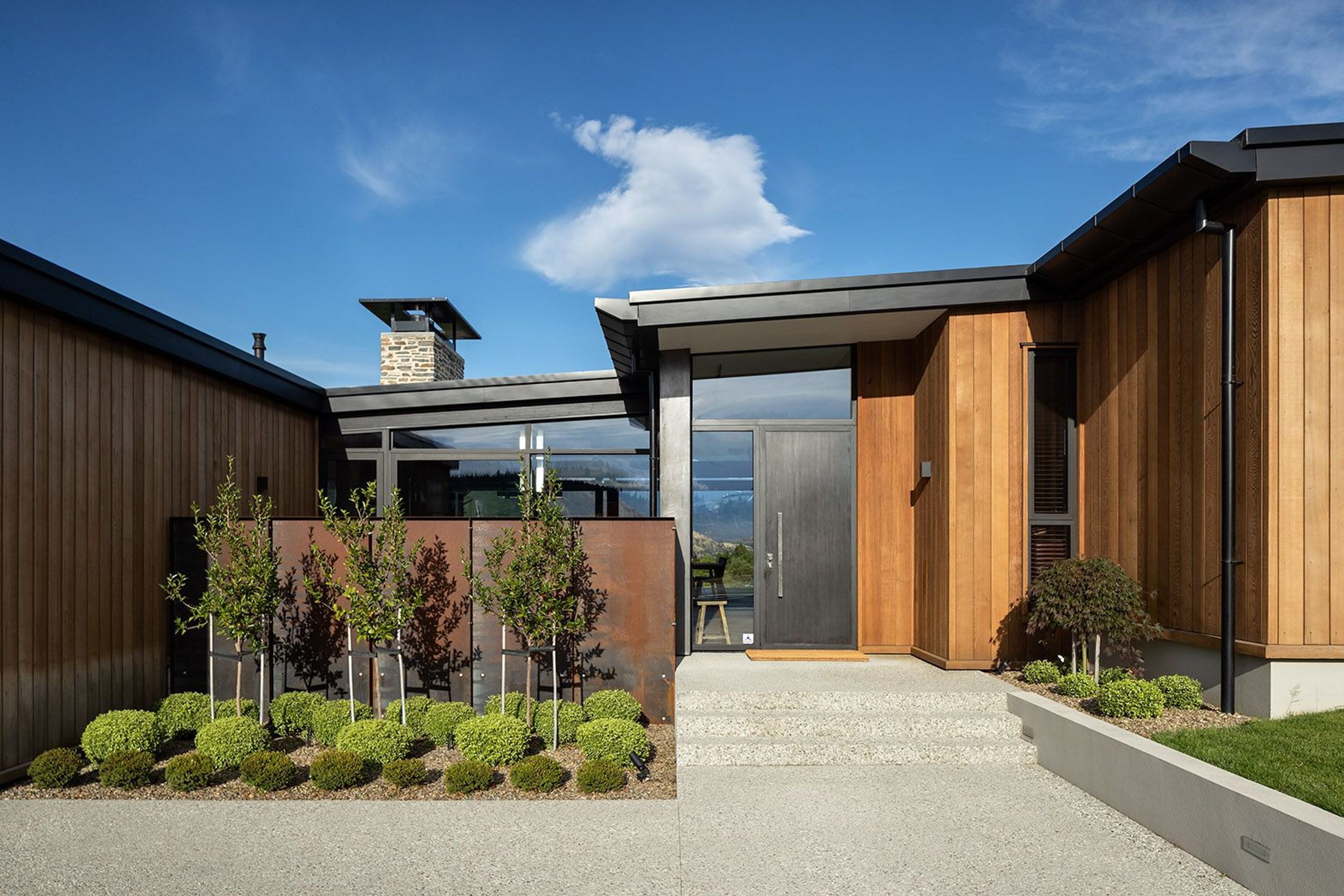 The mix of materials creates a contemporary feel for this Wanaka holiday home and also provides a high level of privacy from the street.