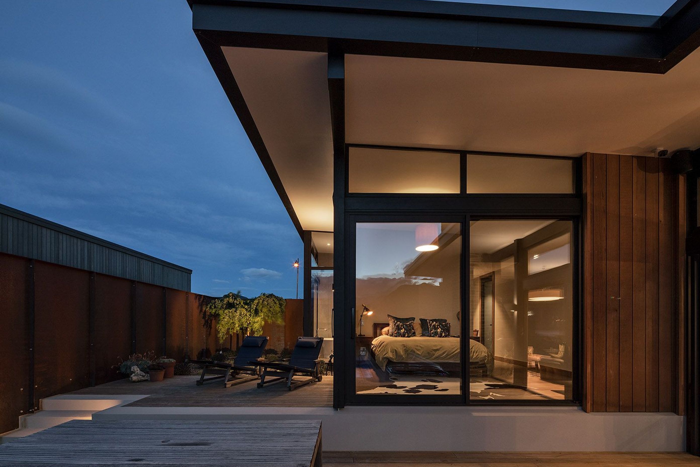 Located in the upper zone, the main bedroom has access to a small deck, which in turns leads onto the pool deck, ideal for early morning laps in the pool.