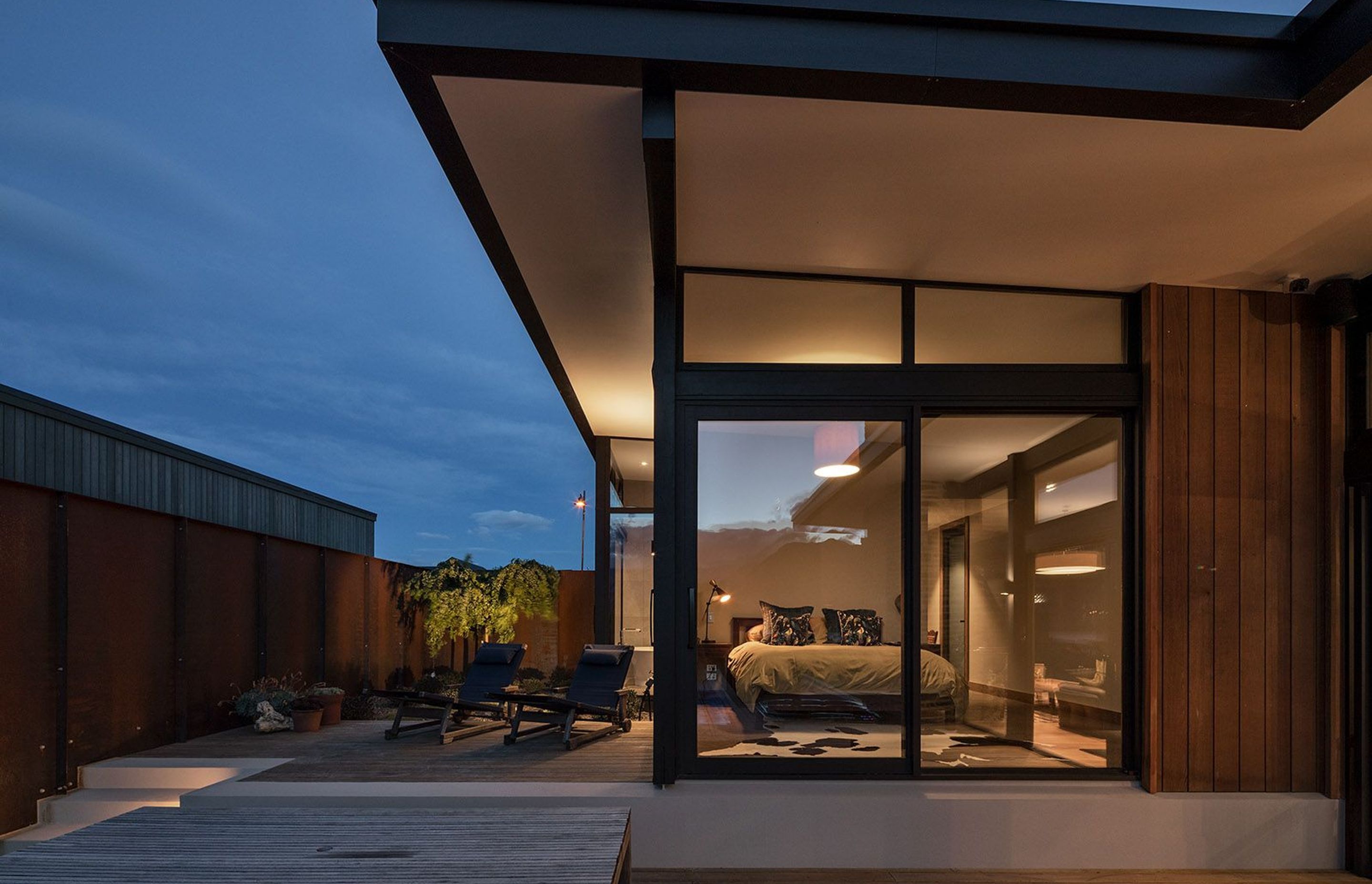 Located in the upper zone, the main bedroom has access to a small deck, which in turns leads onto the pool deck, ideal for early morning laps in the pool.