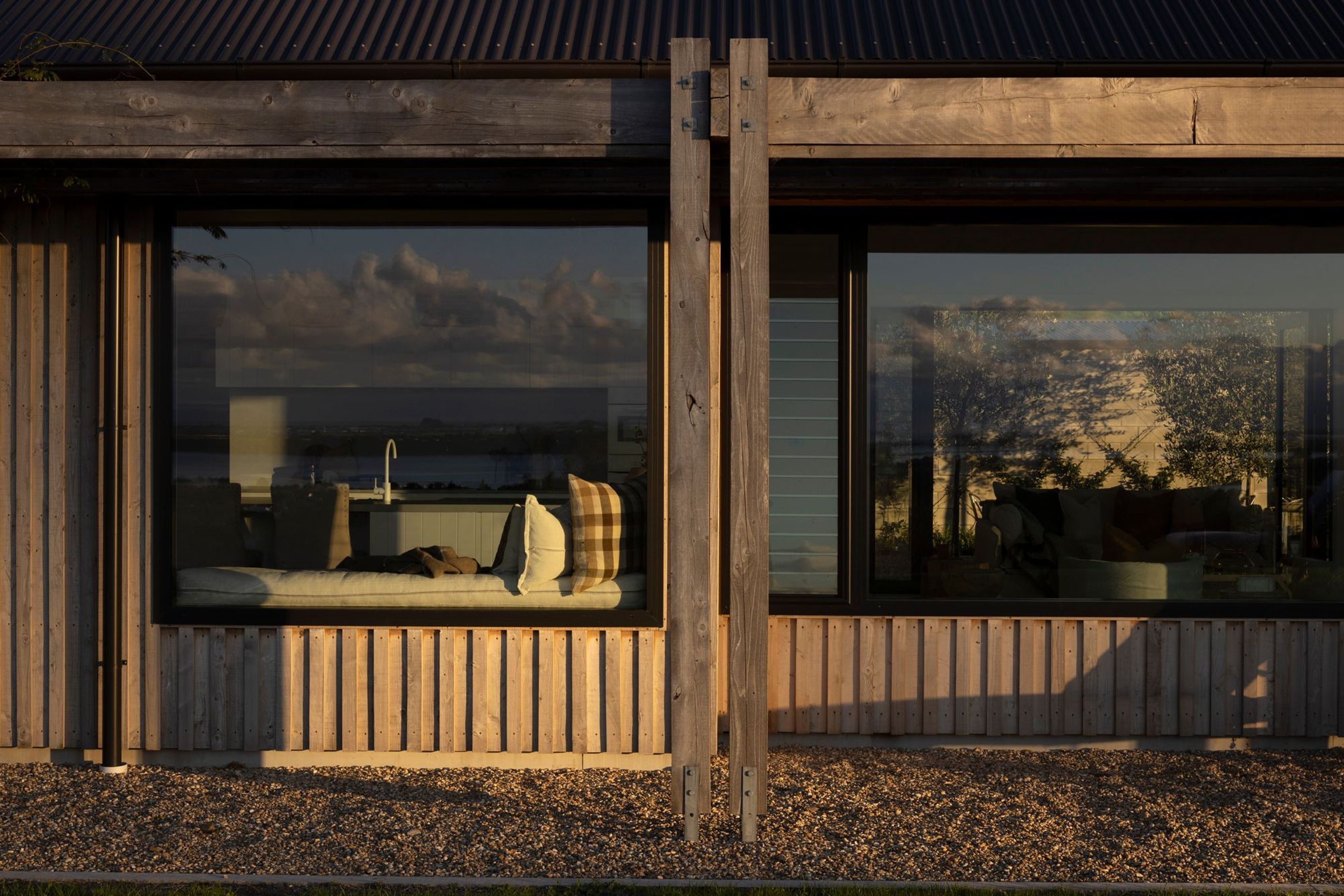 A built-in bench seat provides a nice moment of repose in front of the kitchen, taking in the stunning views.