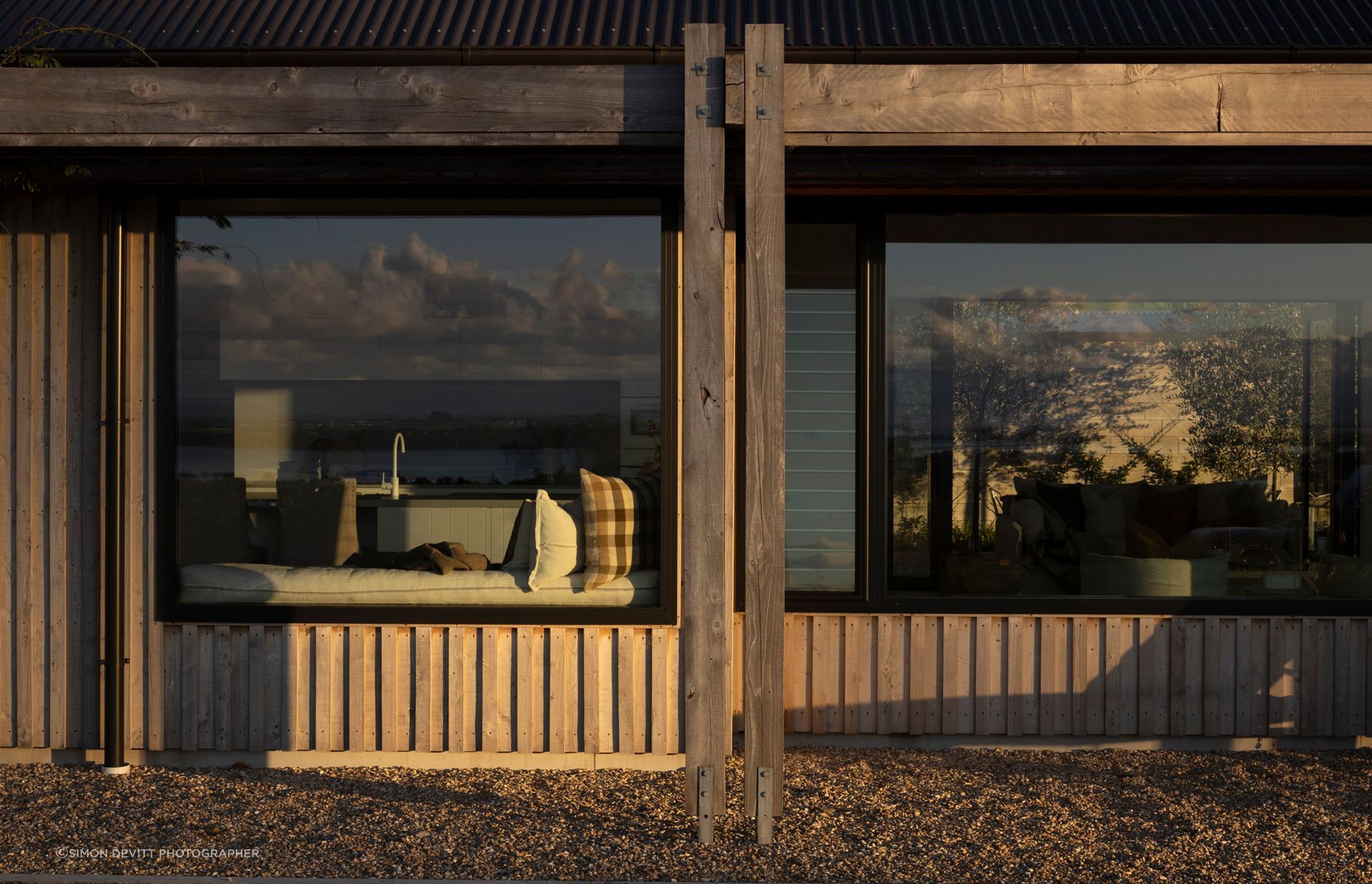 A built-in bench seat provides a nice moment of repose in front of the kitchen, taking in the stunning views.