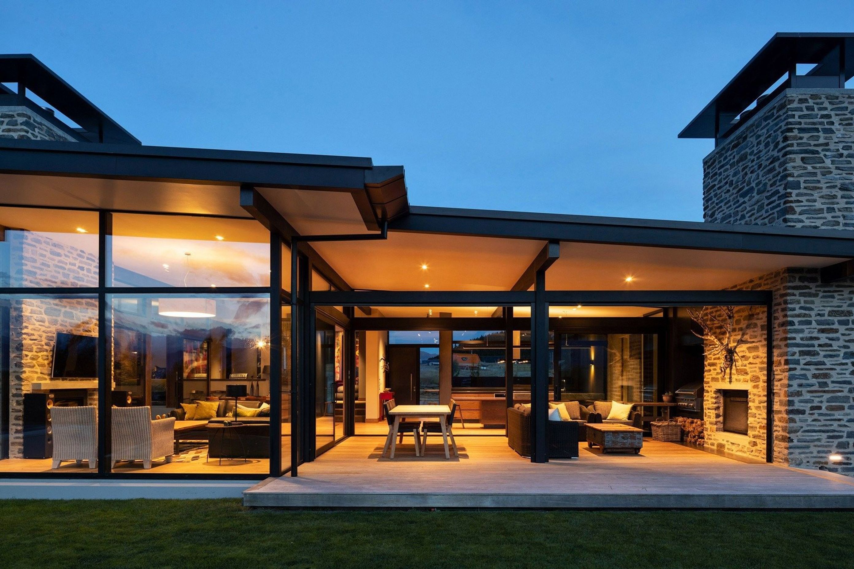 At night, the space truly comes into its own as a place where the family can relax together in an intimate setting or use the entire space for larger gatherings.