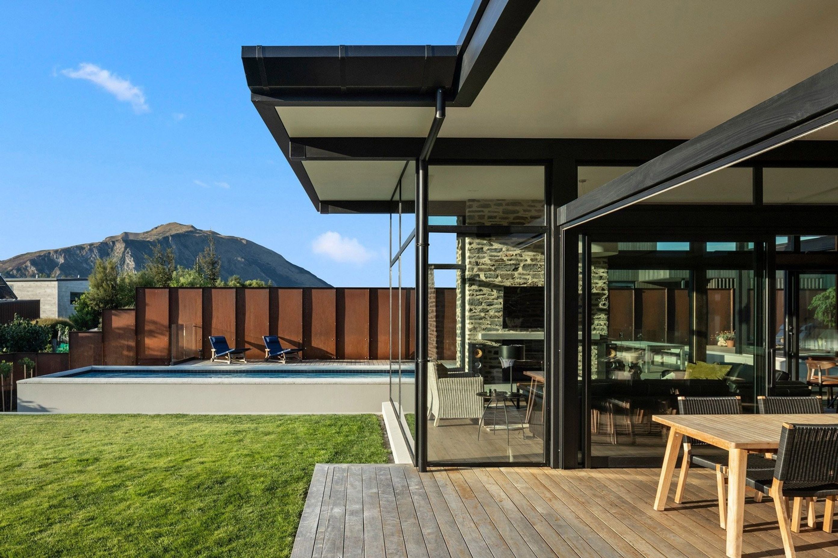 The house has been designed to allow the family to make the most of their holiday time with a large, covered outdoor room, lap pool and spa and a level lawn, created by retaining the site's natural slope.