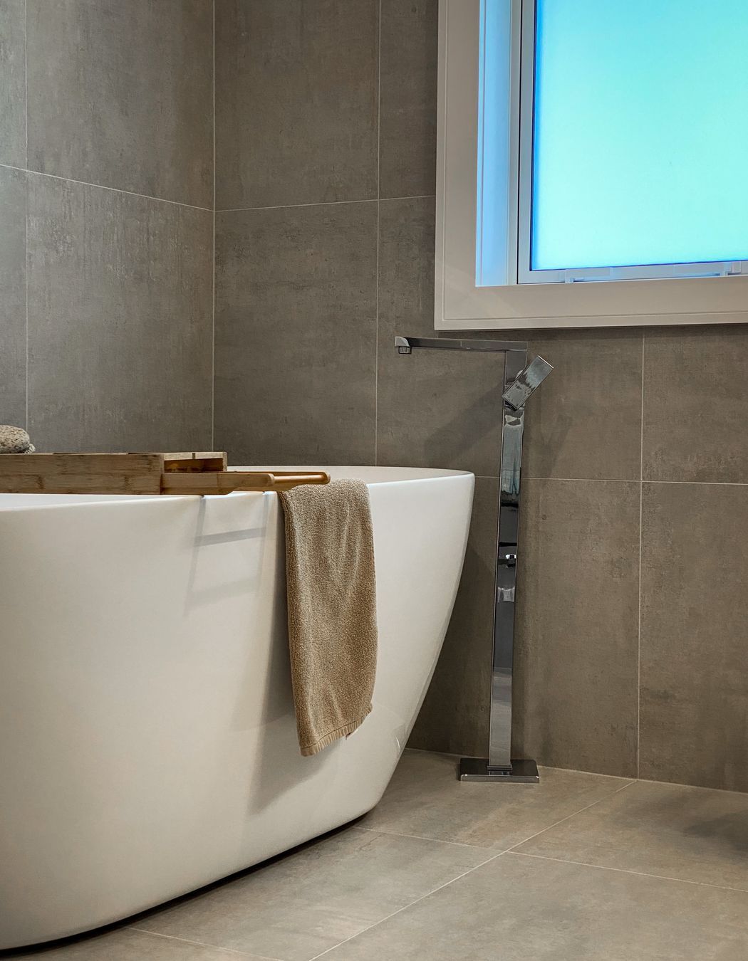 The bathrooms are modern and well-appointed with generous showers, floor to ceiling tiles and a free standing bath in the family bathroom.