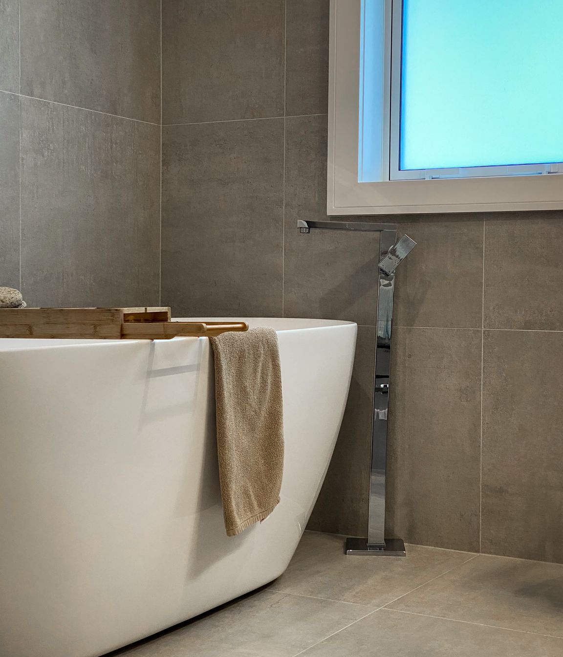 The bathrooms are modern and well-appointed with generous showers, floor to ceiling tiles and a free standing bath in the family bathroom.