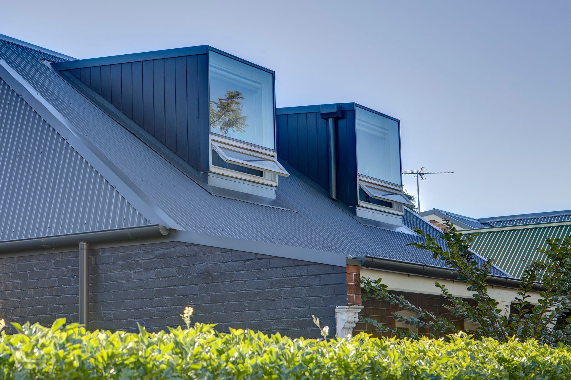 Contemporary dormers signal the contemporary nature of the dwelling.