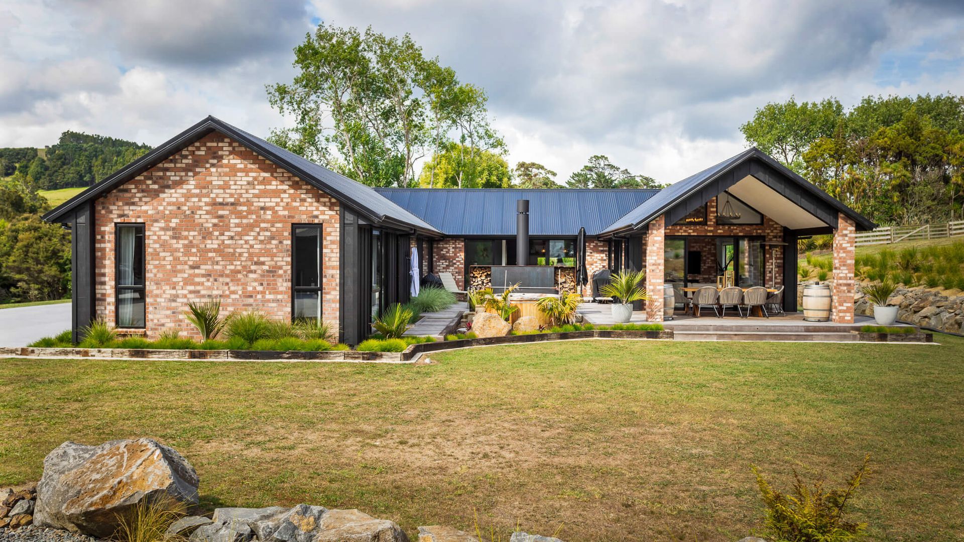 Set amidst the scenic rural landscapes of Muriwai, this beautifully crafted home is a celebration of timeless brickwork, architectural elegance, and modern country living. Designed and built by Madison Park Homes, the residence combines classic materials  video