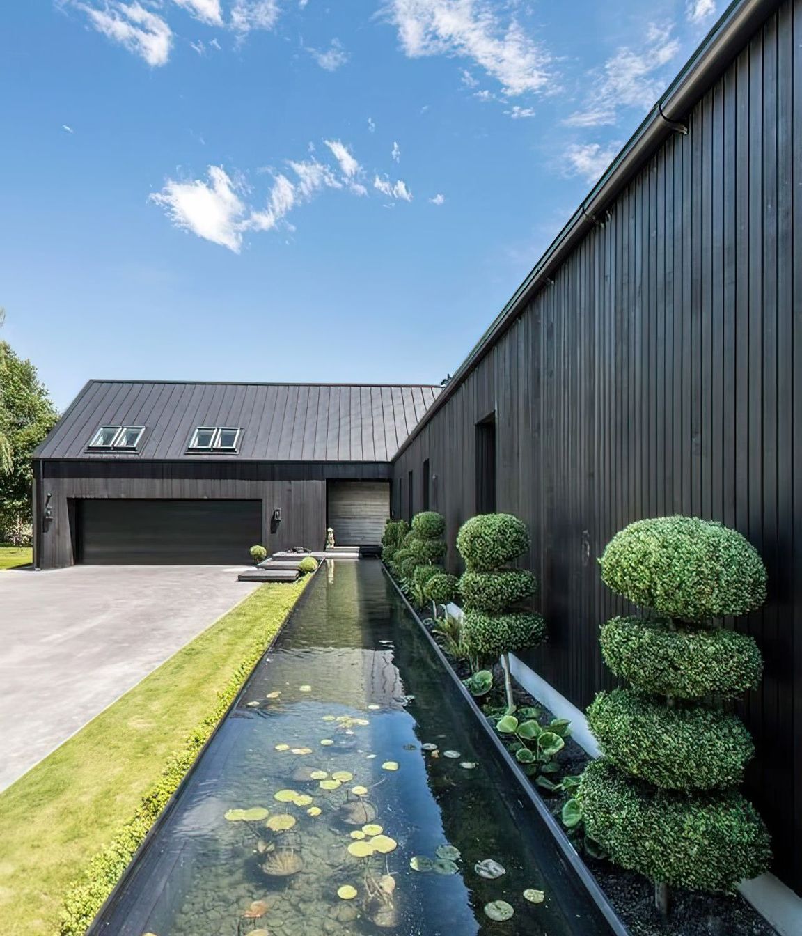 The-pond-and-plant-area-showing-the-weatherboard-and-tray-roofing-topaz-very-compressed-2x-v2.jpeg