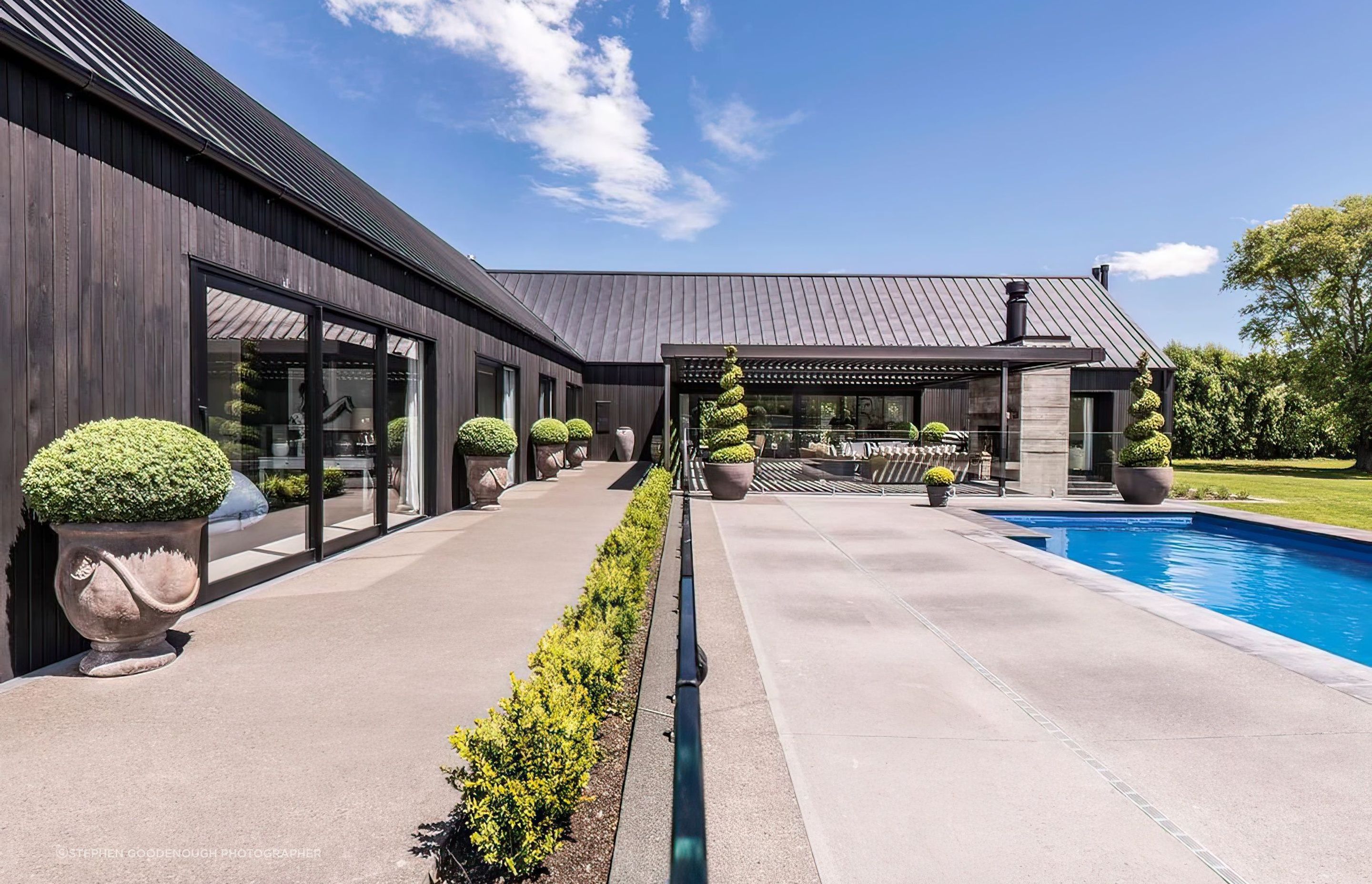 The-pool-area-and-exterior-featuring-grooved-cedar-weatherboard-large-feature-windows-tray-roofing-topaz-very-compressed-2x-v2.jpeg
