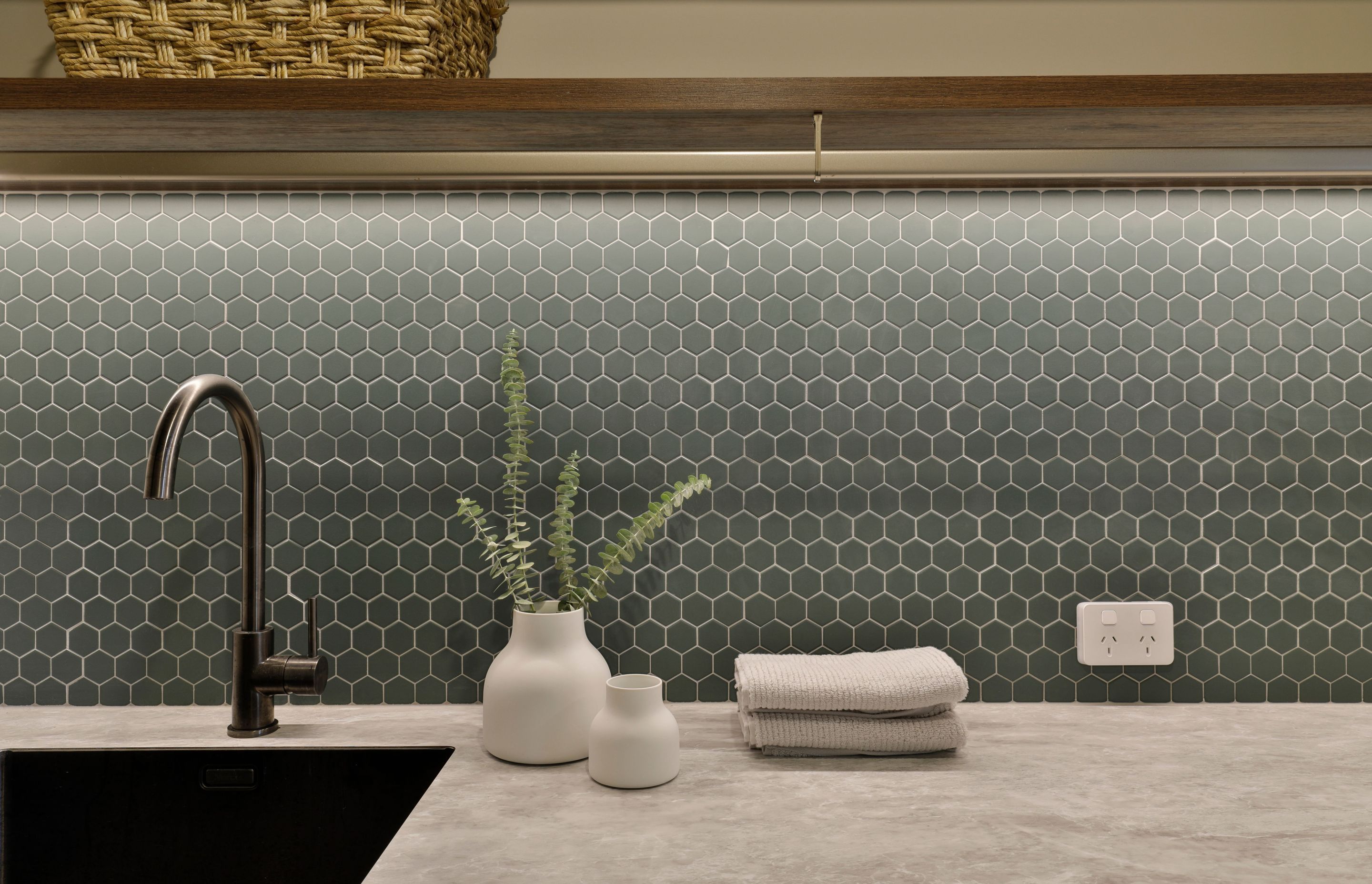 Design by Cube Dentro. Laundry splashback Beton Green Echo Hex Mosaic 316x316mm