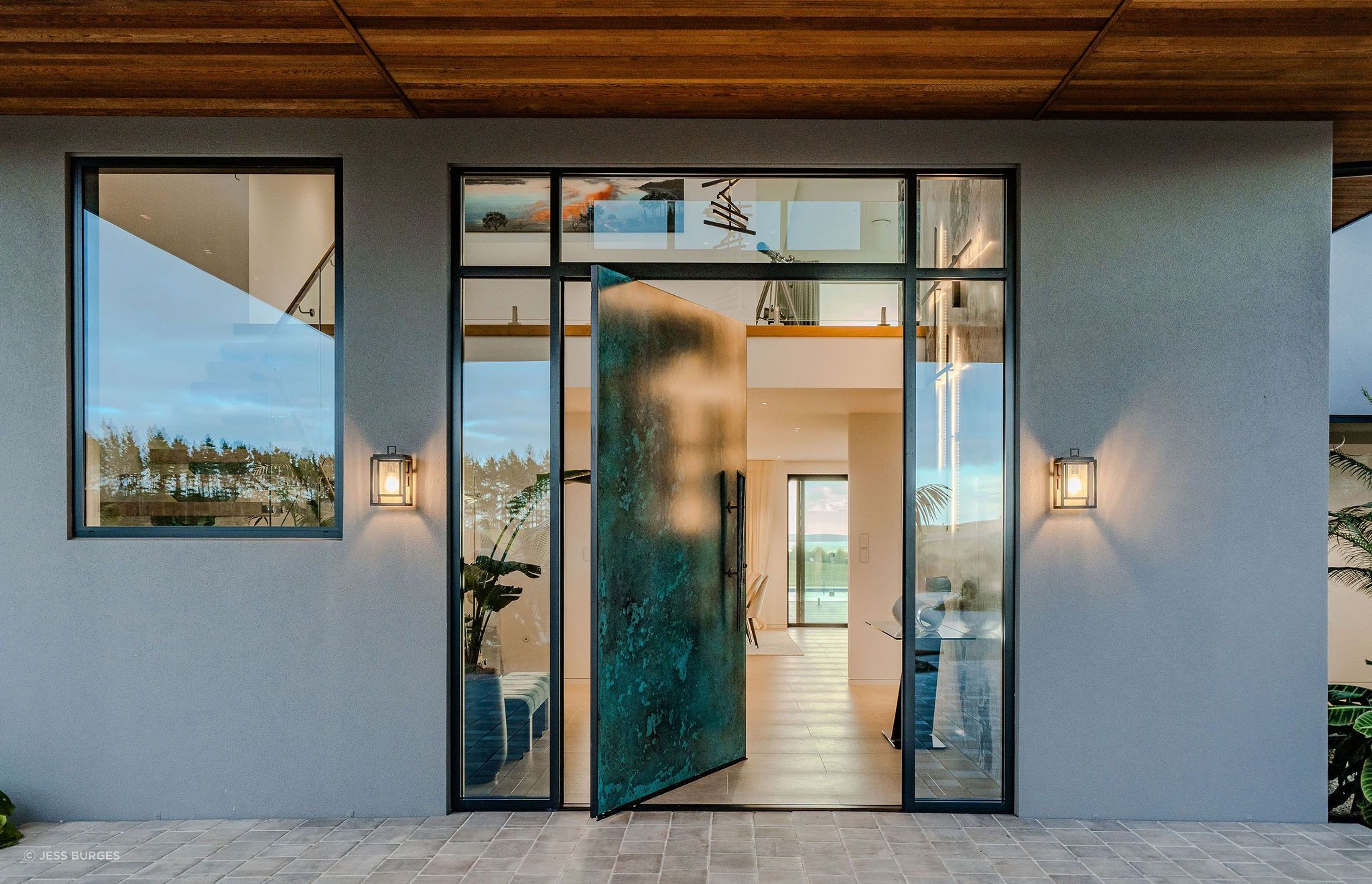 entry-pivot-door-steel-welcoming-grand-cedar-plaster-paving-arcline.jpg
