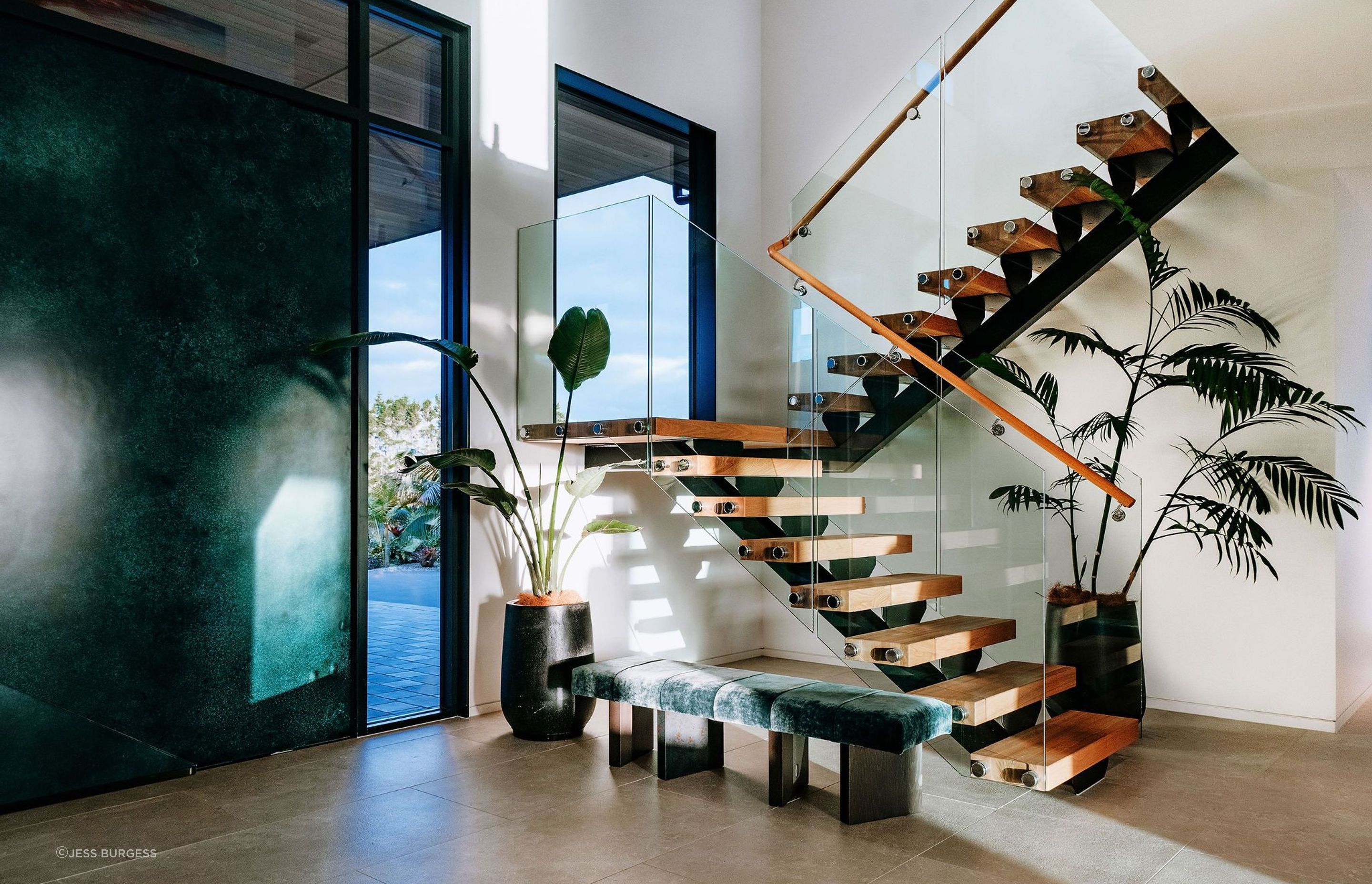 entry-stairs-floating-glass-steel-indoor-plants-seating-arcline-architecture.jpg