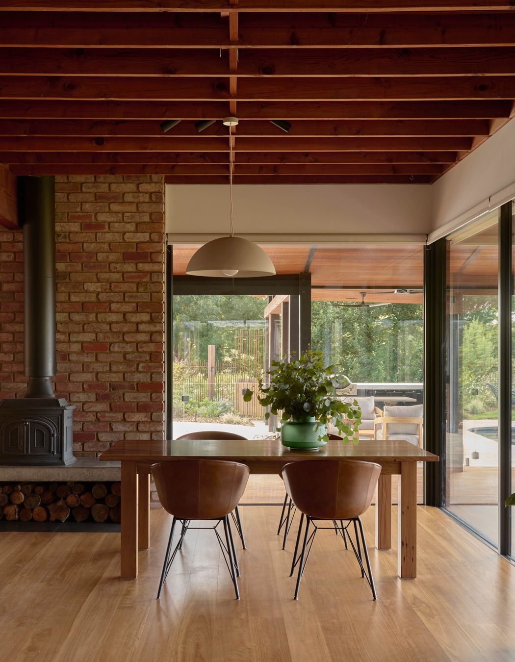 Light Large Dome Pendant by Beacon Lighting. Leather dining chairs by Matt Blatt Furniture. Recycled spotted gum table made by Eco Timber Group. Solid blackbutt timber flooring from Eco Timber Group. Parisi Gourd Vase by Provincial Home Living.