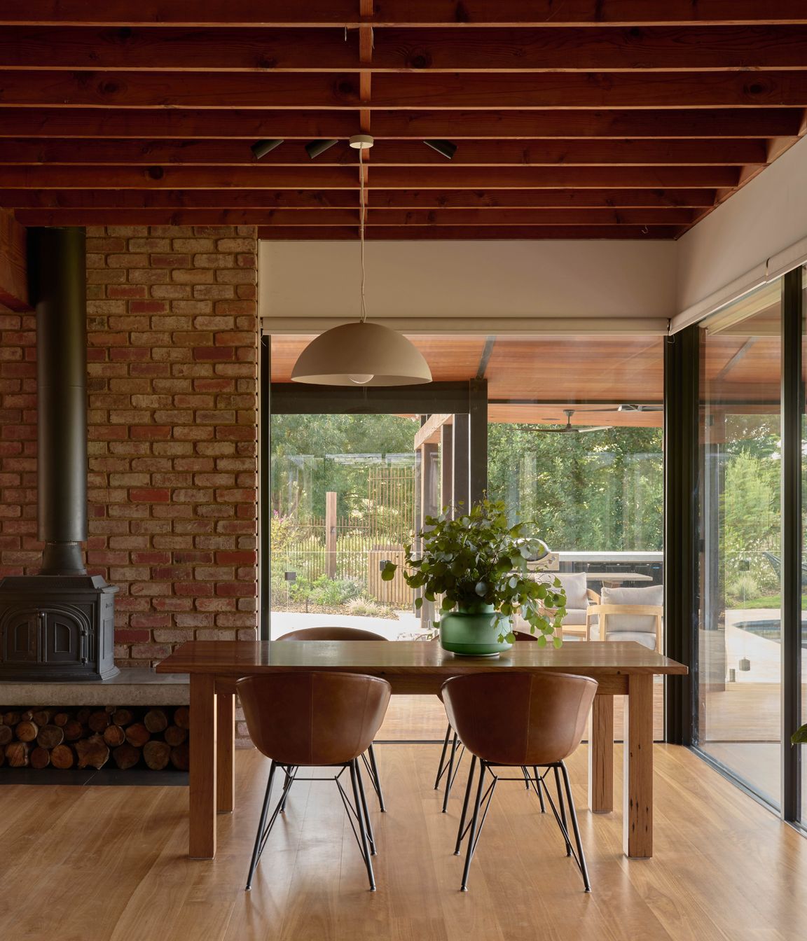 Light Large Dome Pendant by Beacon Lighting. Leather dining chairs by Matt Blatt Furniture. Recycled spotted gum table made by Eco Timber Group. Solid blackbutt timber flooring from Eco Timber Group. Parisi Gourd Vase by Provincial Home Living.