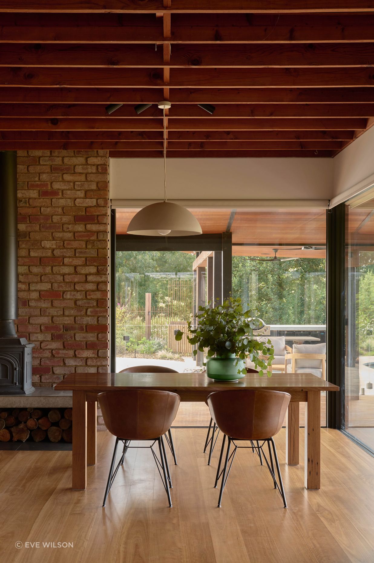 Light Large Dome Pendant by Beacon Lighting. Leather dining chairs by Matt Blatt Furniture. Recycled spotted gum table made by Eco Timber Group. Solid blackbutt timber flooring from Eco Timber Group. Parisi Gourd Vase by Provincial Home Living.