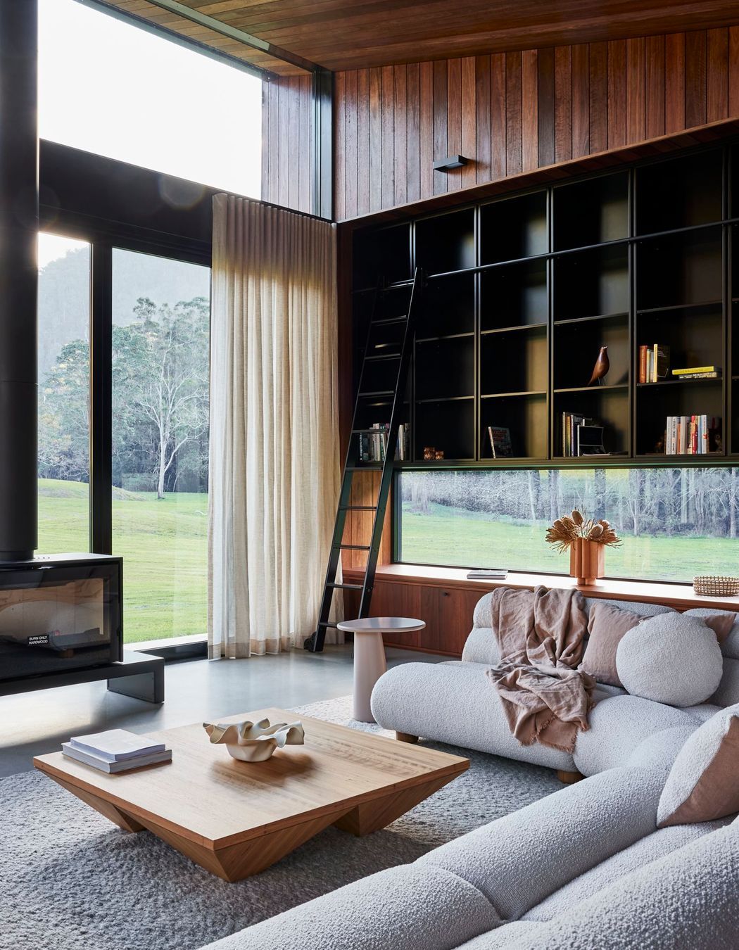 shaun-lockyer-architects-amaroo-rural-interior-design-living-room-fireplace-bookshelf.jpg