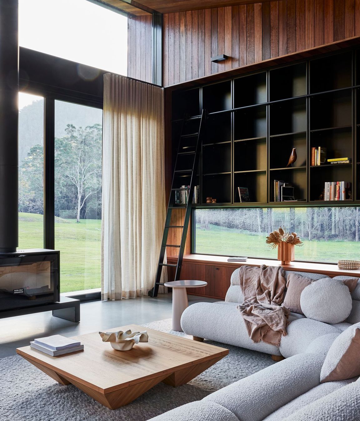 shaun-lockyer-architects-amaroo-rural-interior-design-living-room-fireplace-bookshelf.jpg